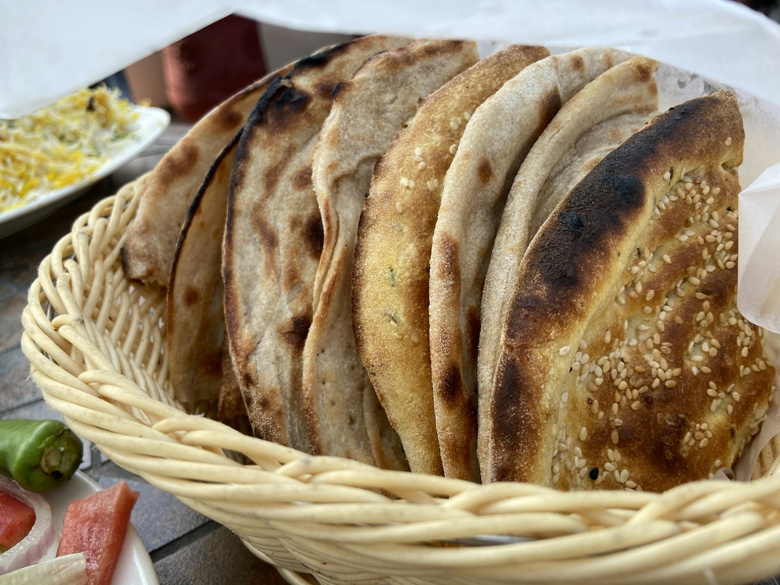 Basket of fresh naan and roti