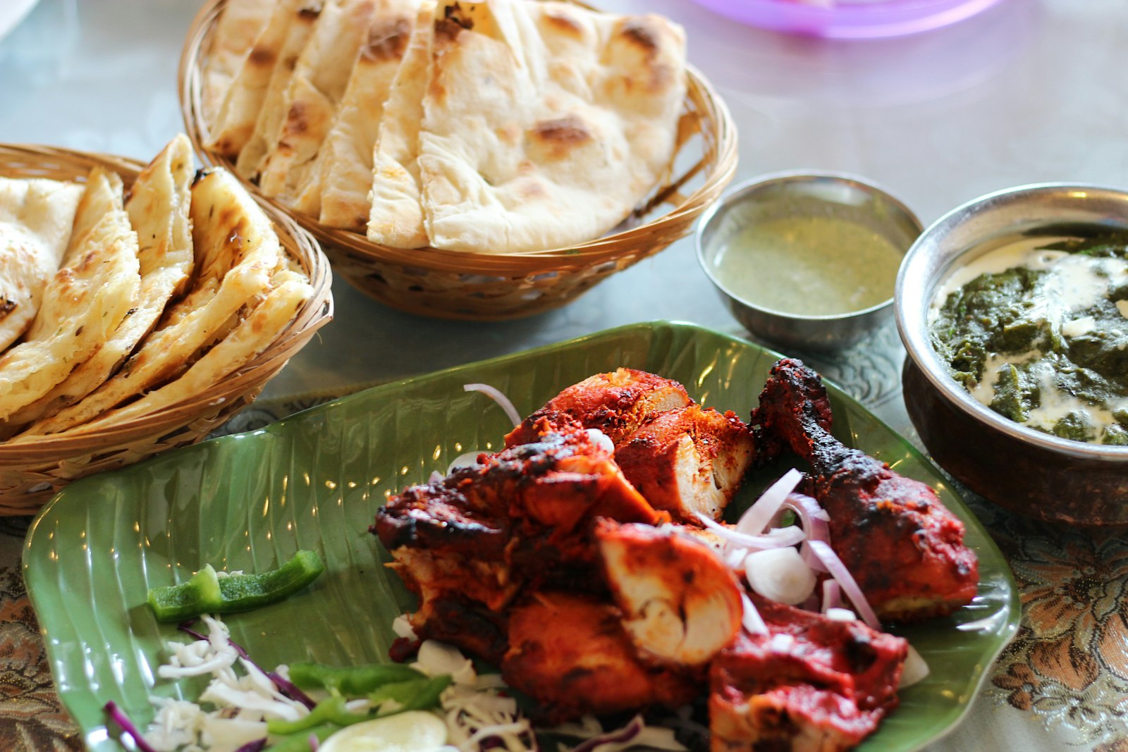 Chicken tikka with naan for a Pakistani dinner