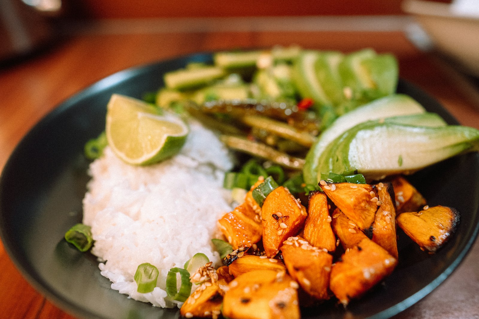 Rice bowl with avocado, lime and roasted sweet potato
