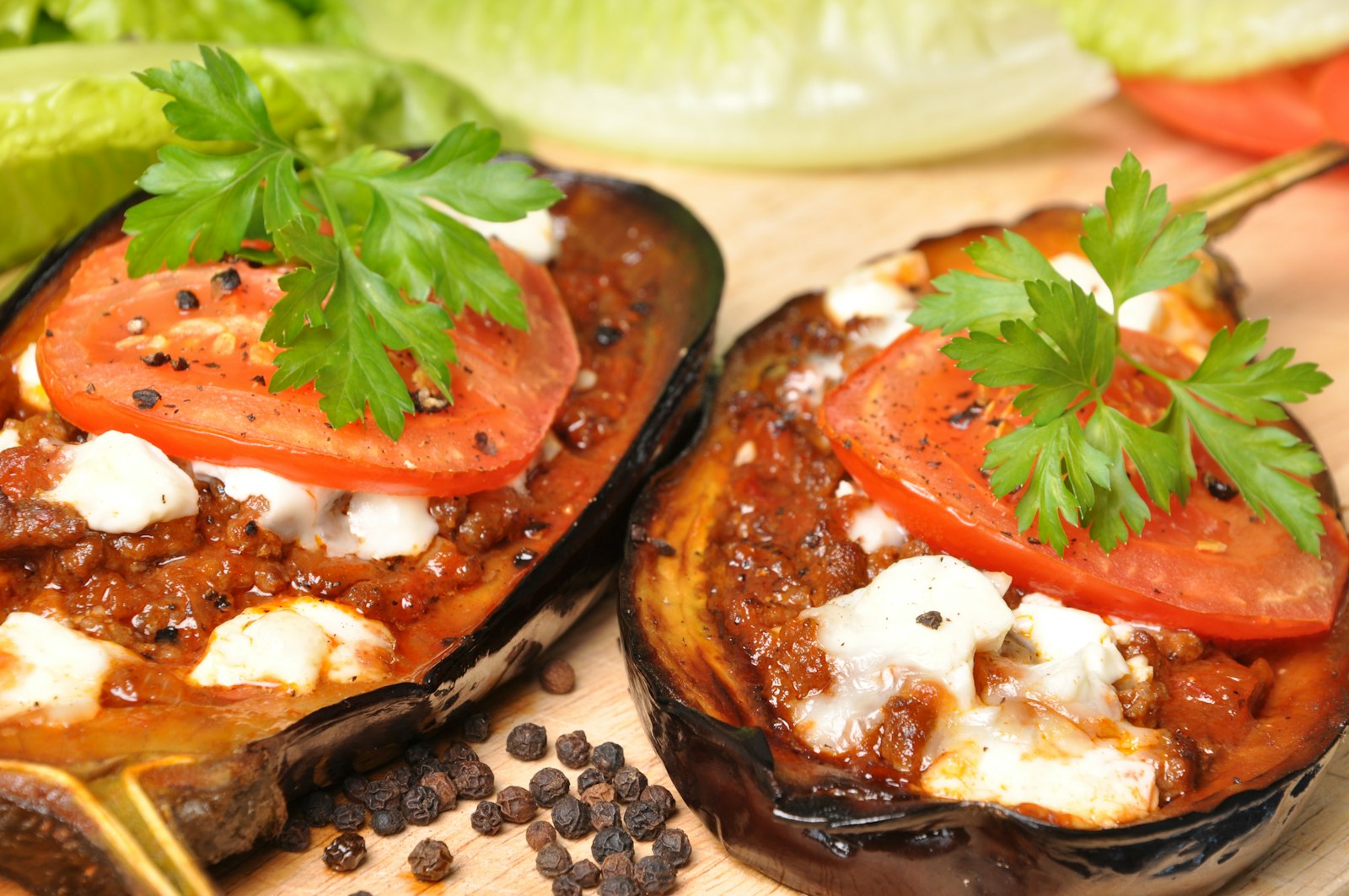 Stuffed dinners baked eggplant halves with tomato and parsley
