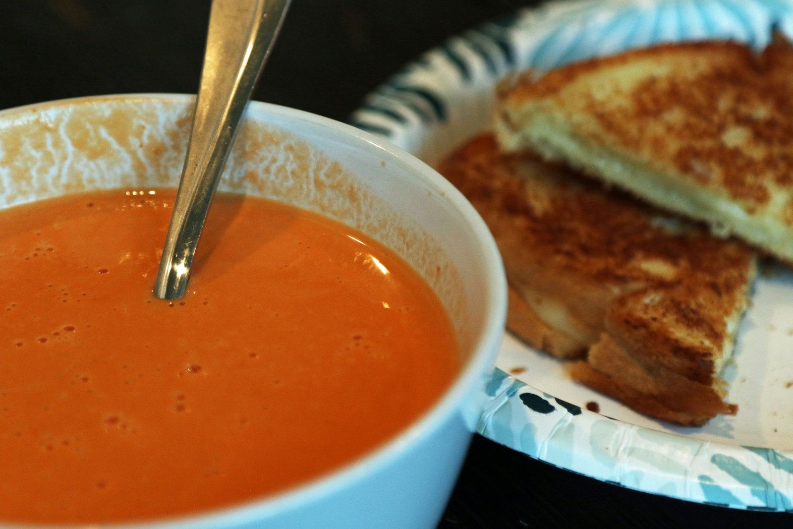 Grilled cheese with a bowl of tomato soup