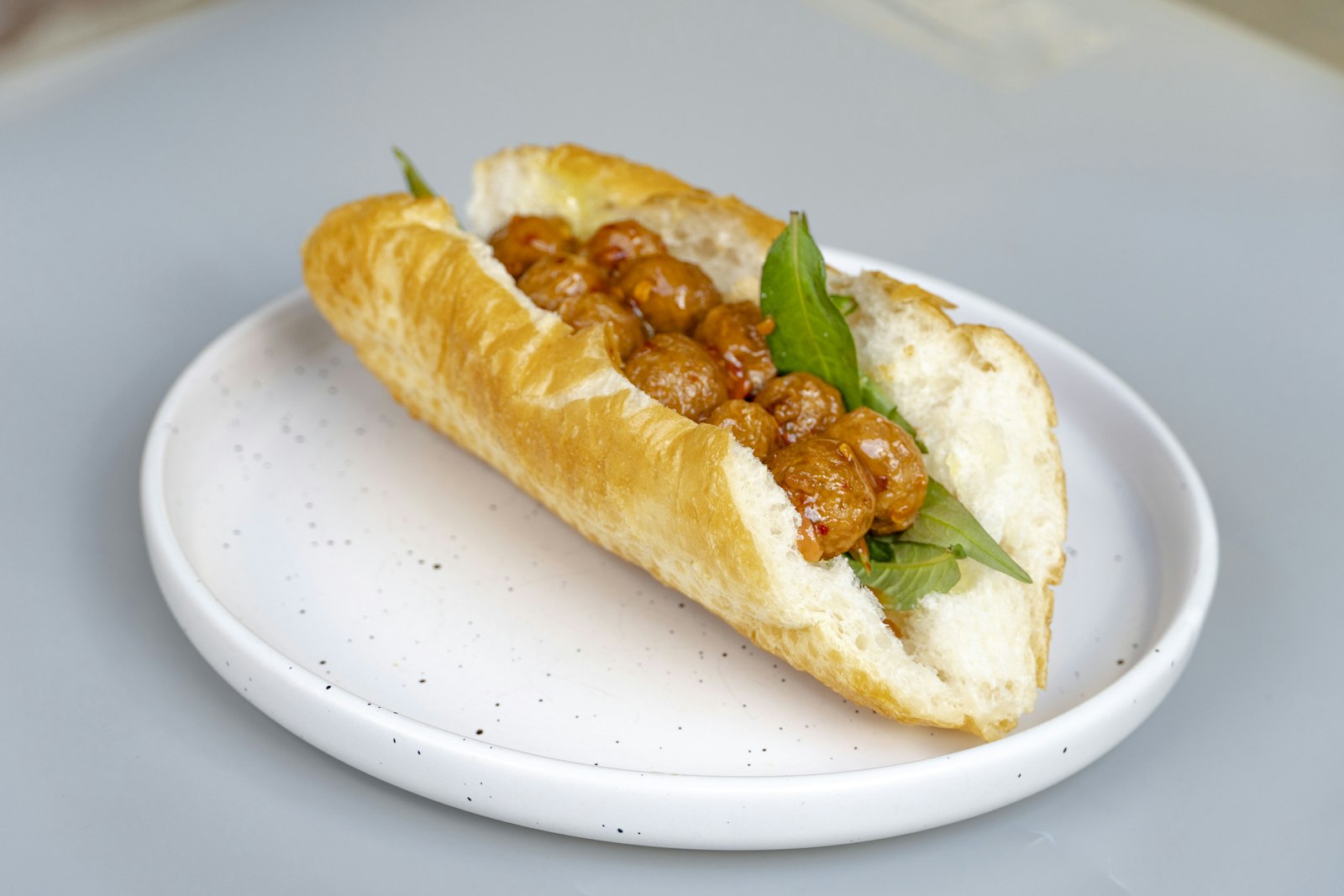 Hot sandwiches: meatball sub with marinara on a plate
