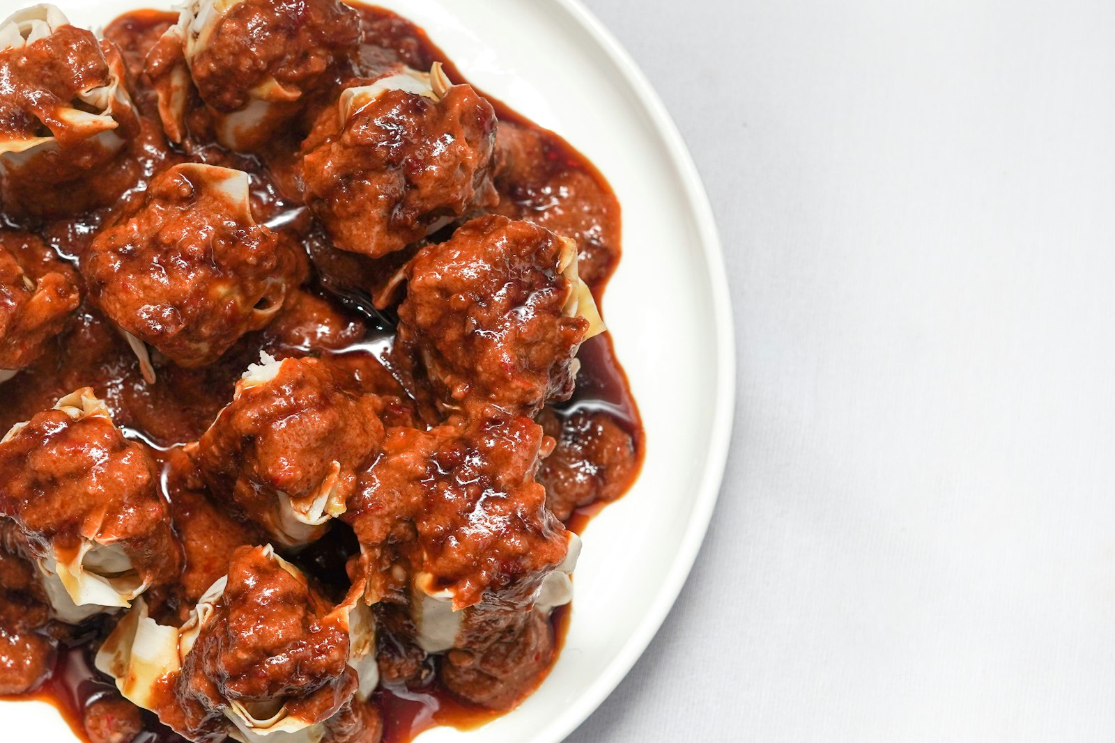 Glazed grape jelly BBQ meatballs in a bowl