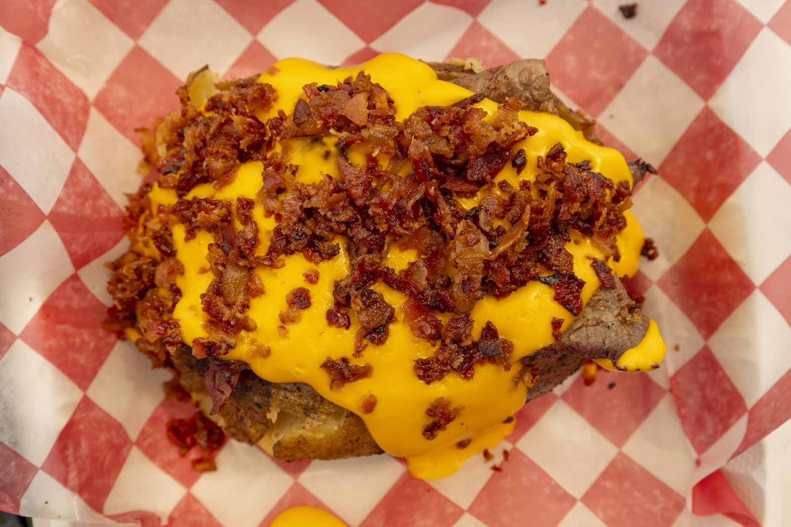 Loaded baked potato with bacon and melted cheddar