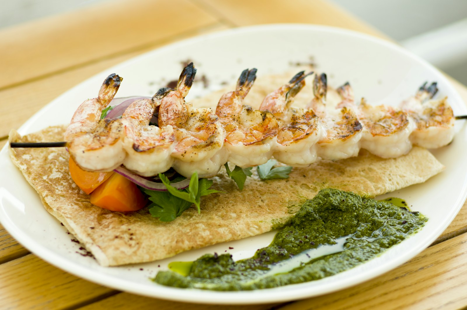 Grilled shrimp skewers with lime and herbs