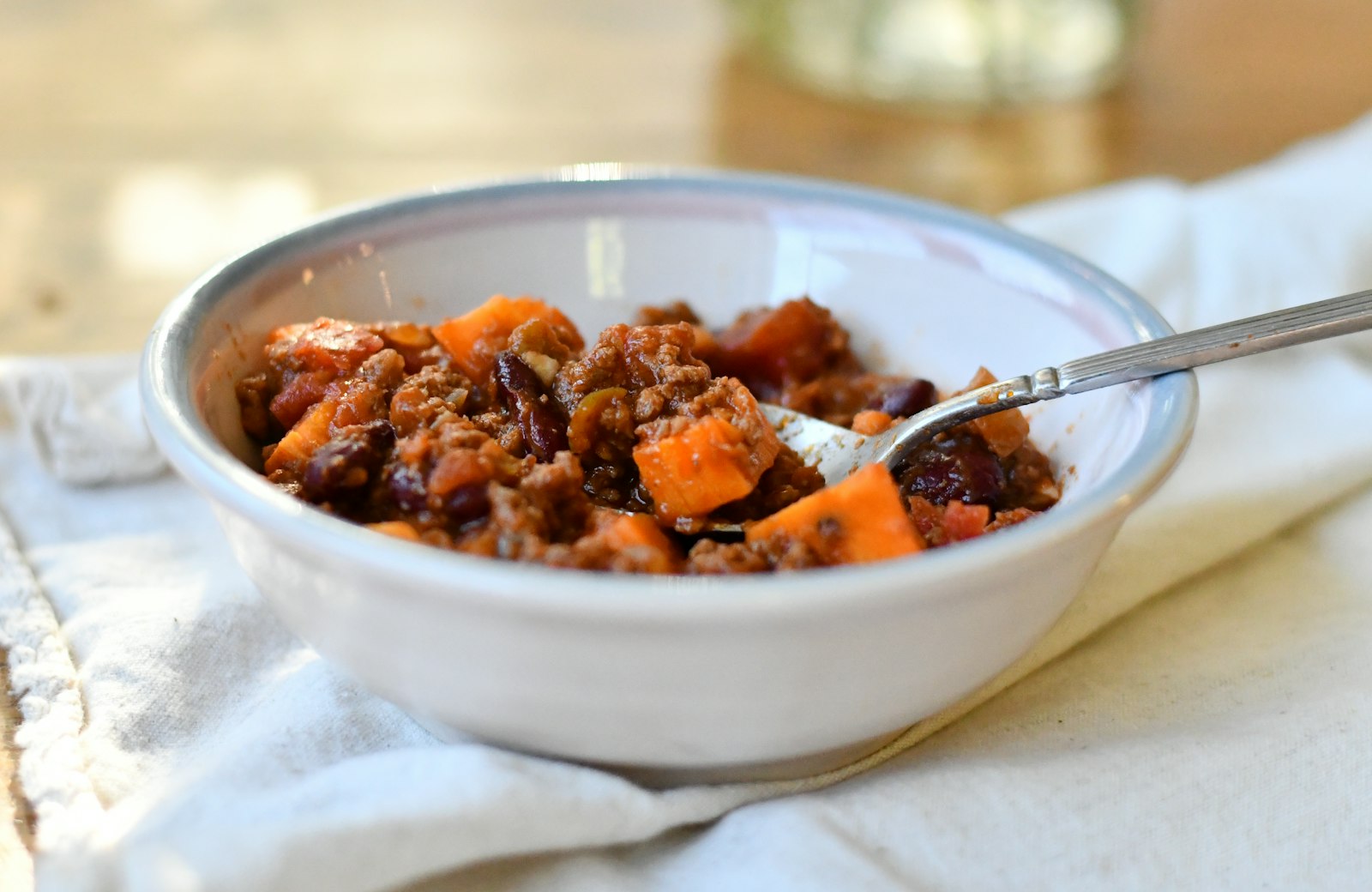 Sweet potato and black bean stew in a white bowl