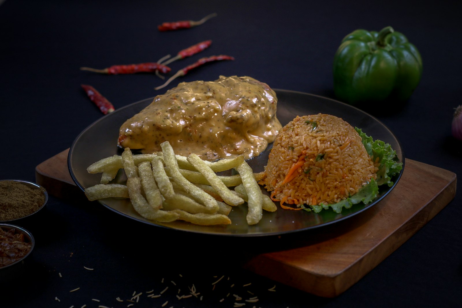 Chicken in creamy mushroom sauce with fries