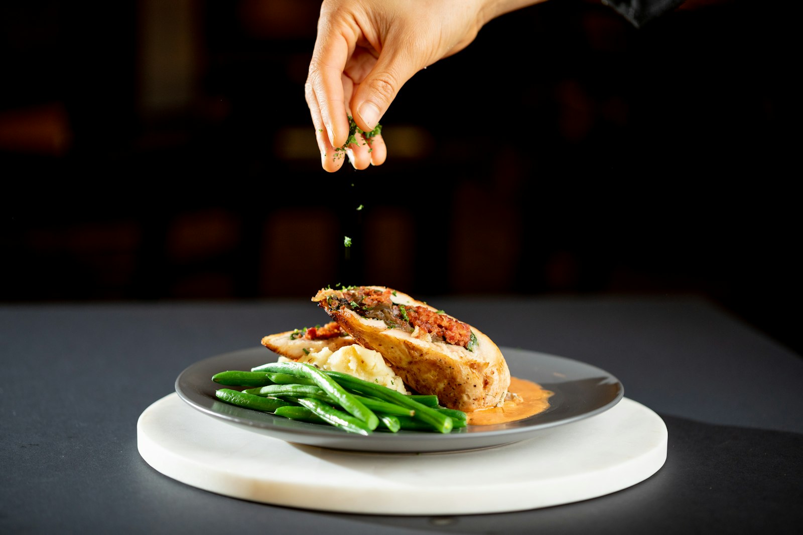 Stuffed chicken breast with green beans, a fancy chicken breast dinner
