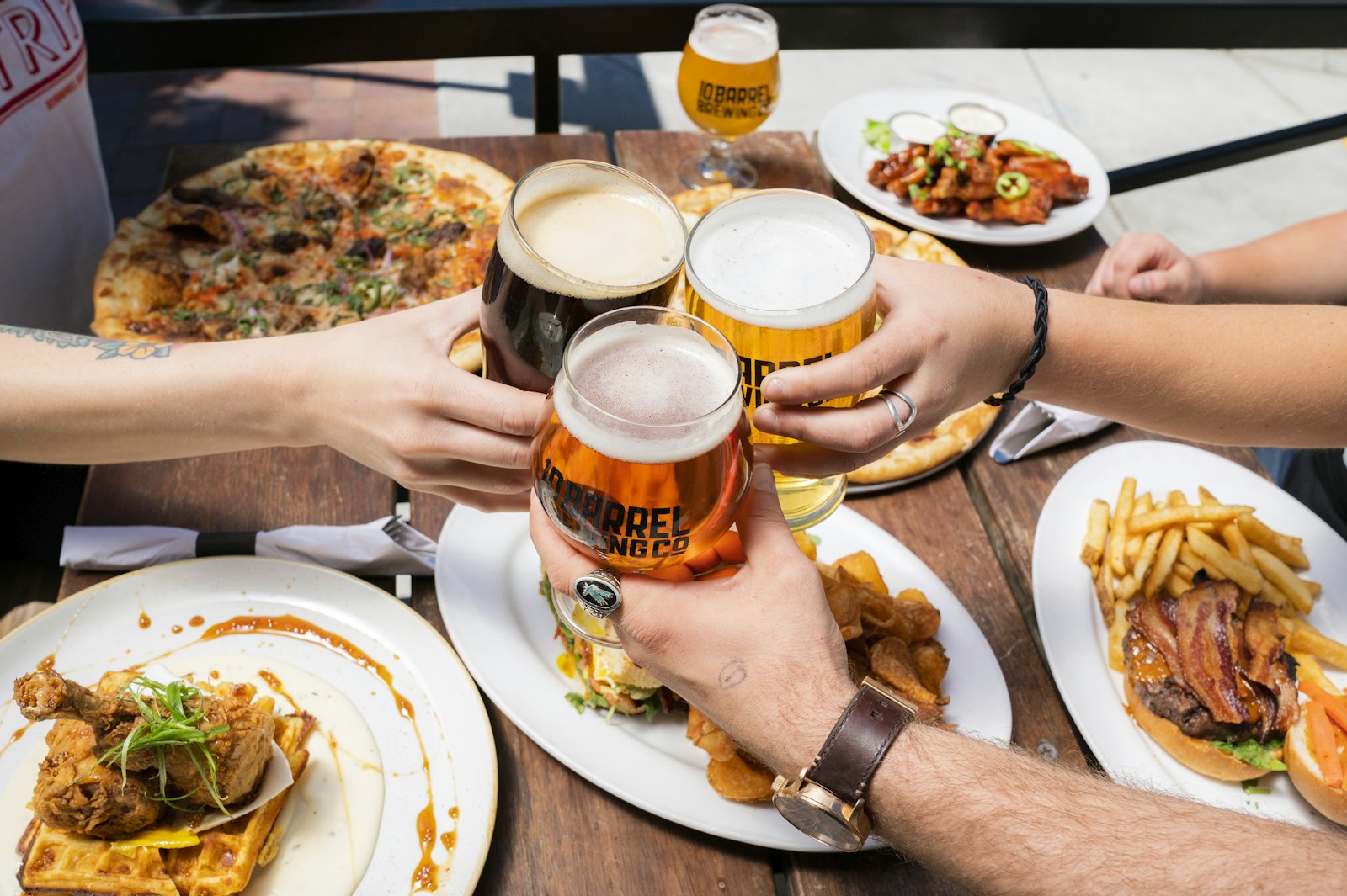 Friends sharing German dinners and beer