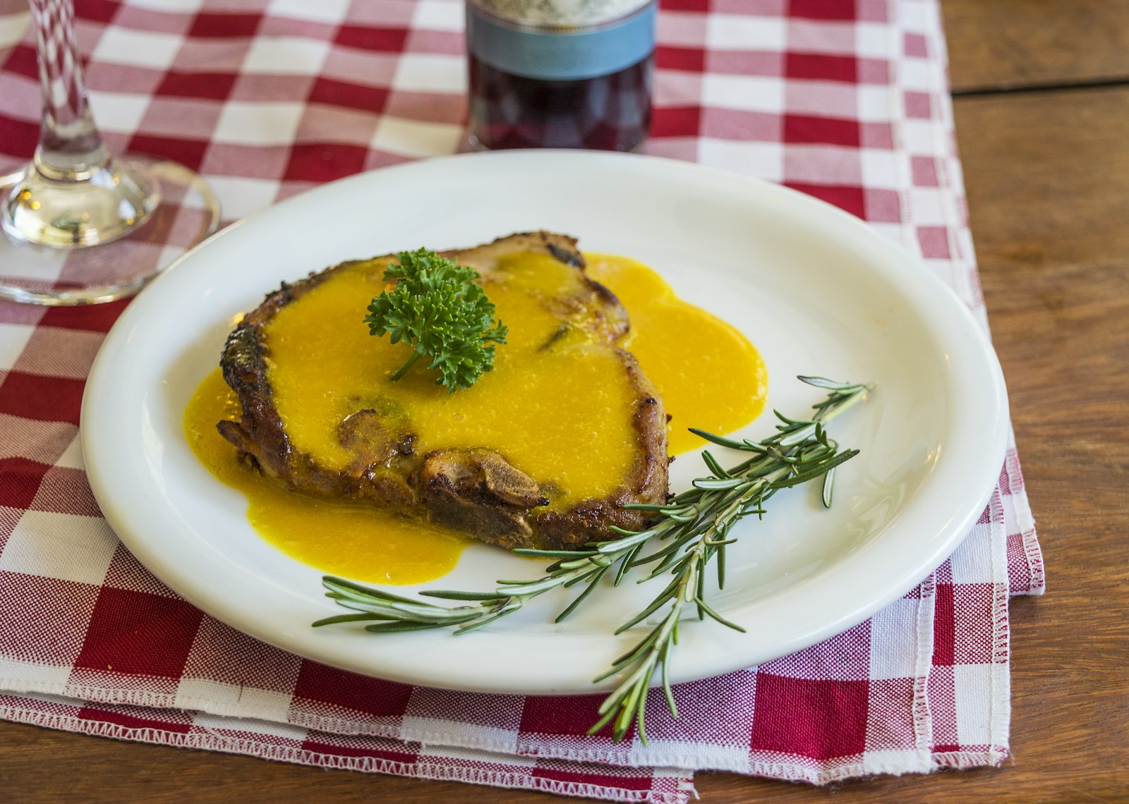 Smoked pork chop on a white plate