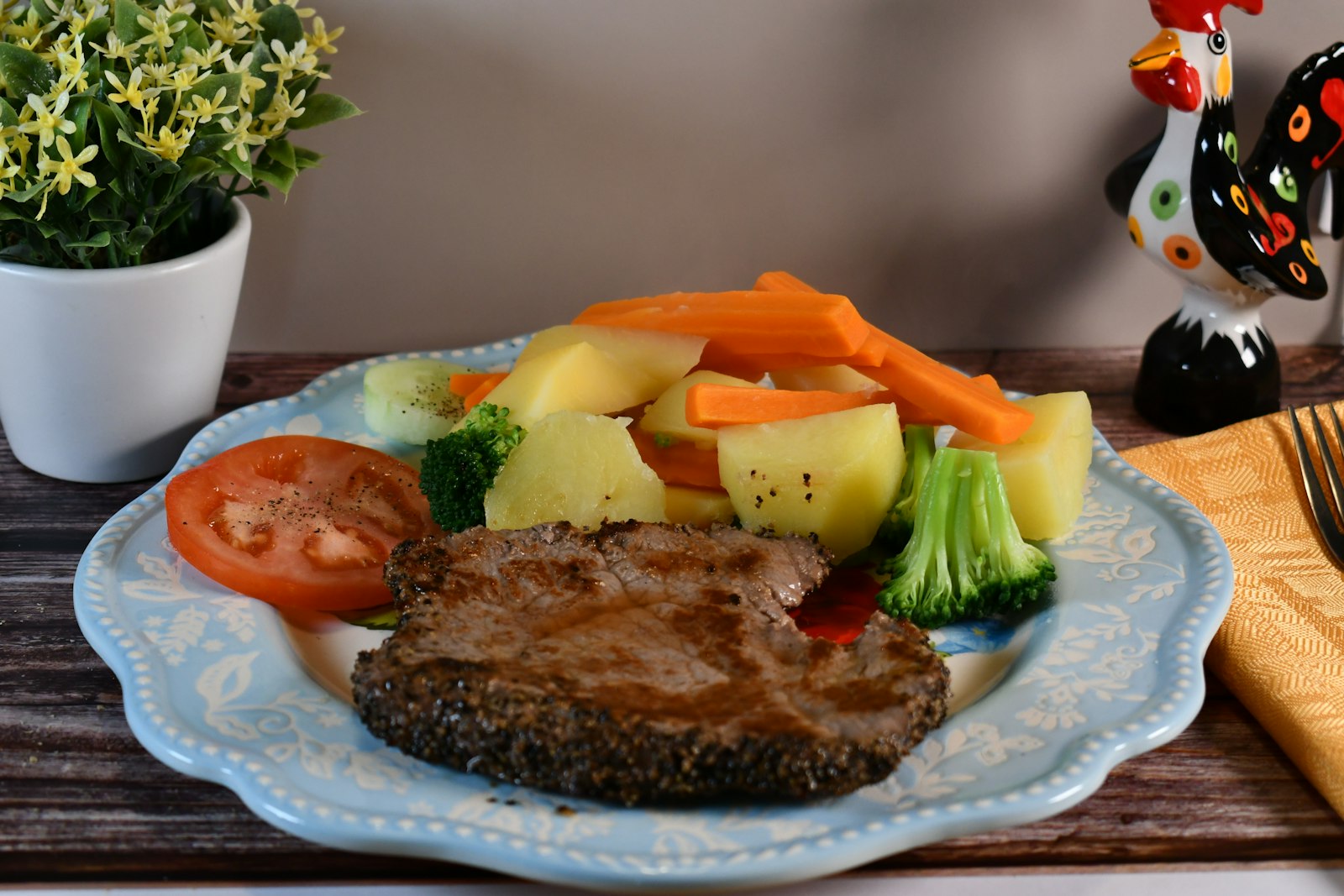 Steak with boiled potatoes and vegetables