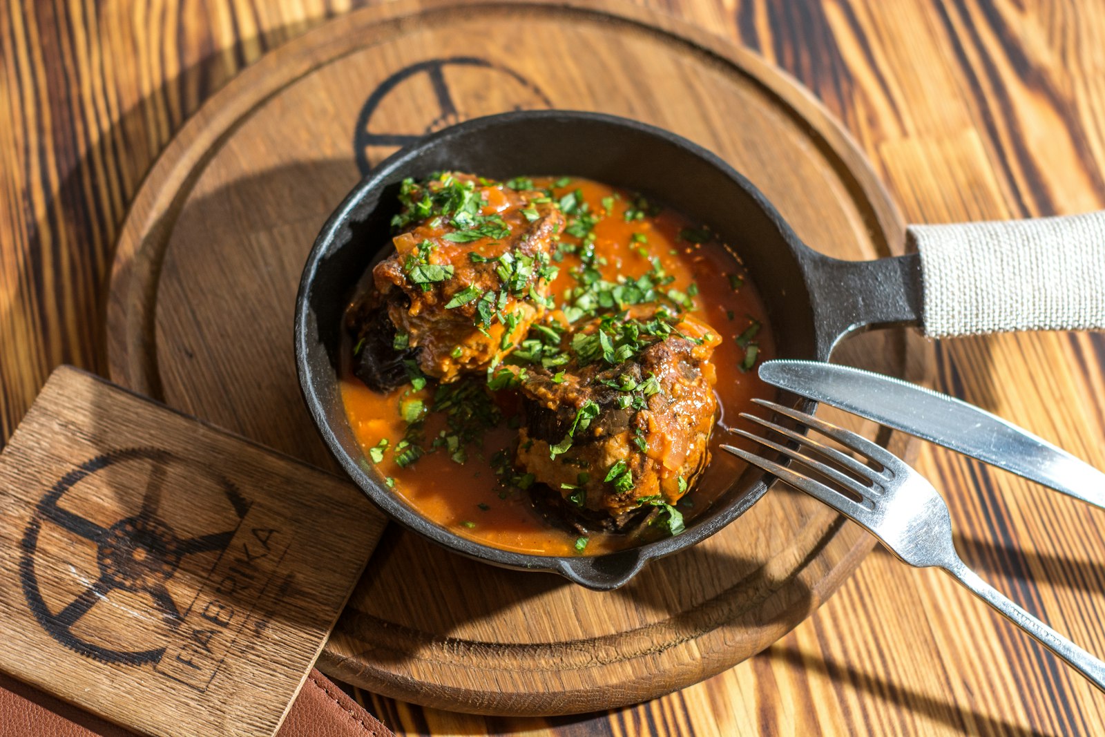 Beef rolls in gravy in a skillet