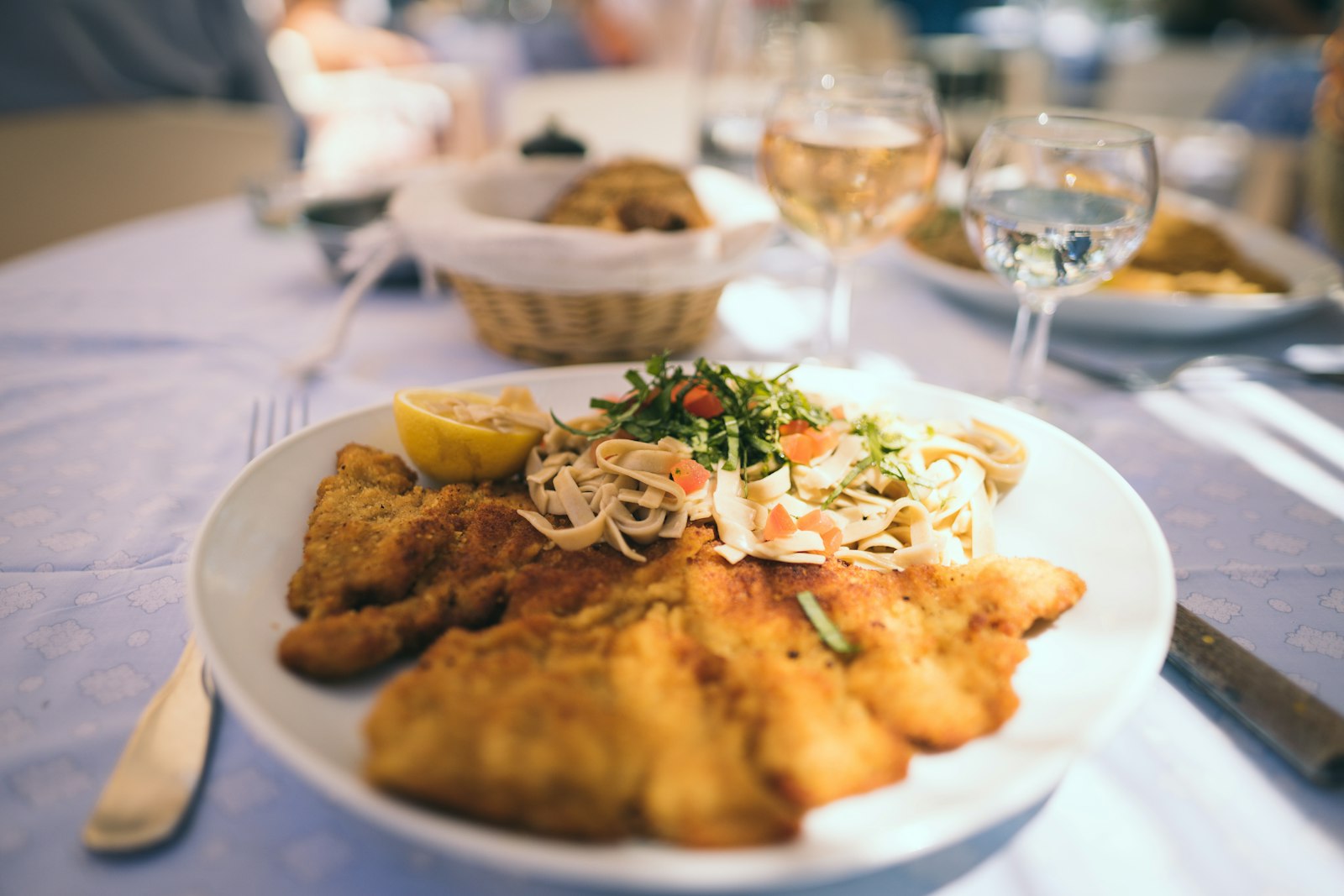 Golden schnitzel with salad on a plate