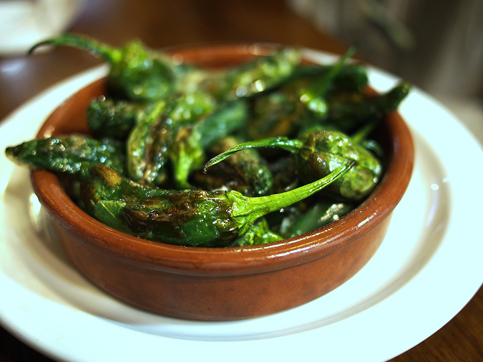 Blistered green padron peppers