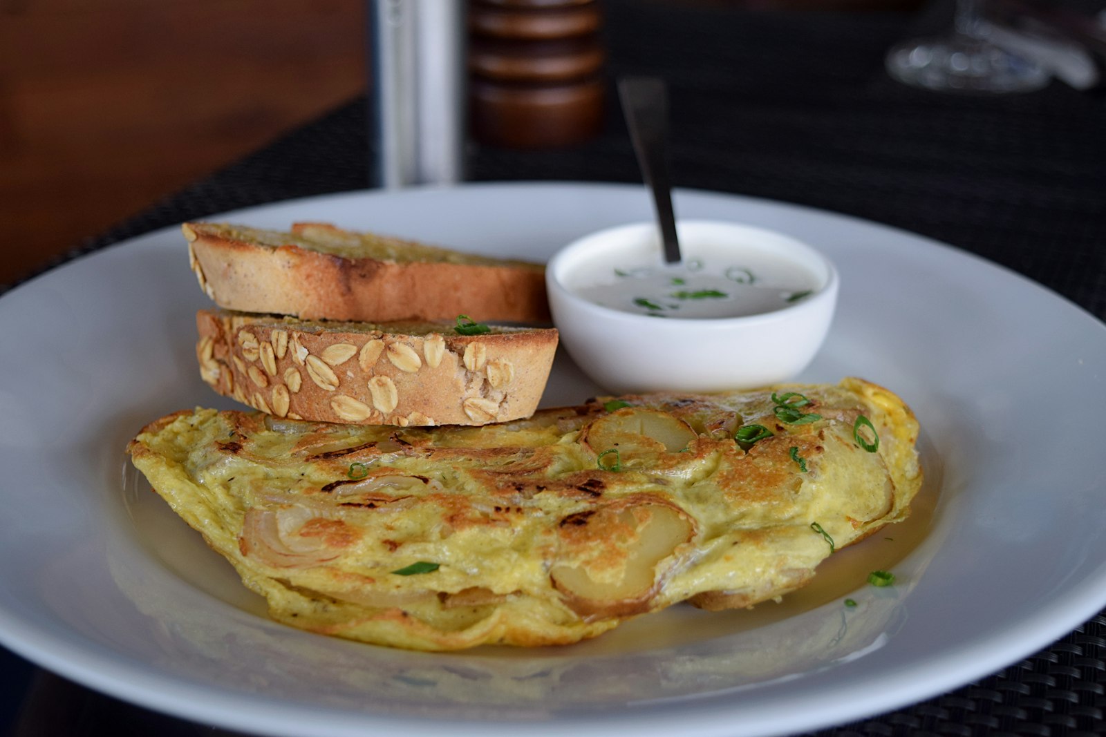 Spanish tortilla wedge with bread