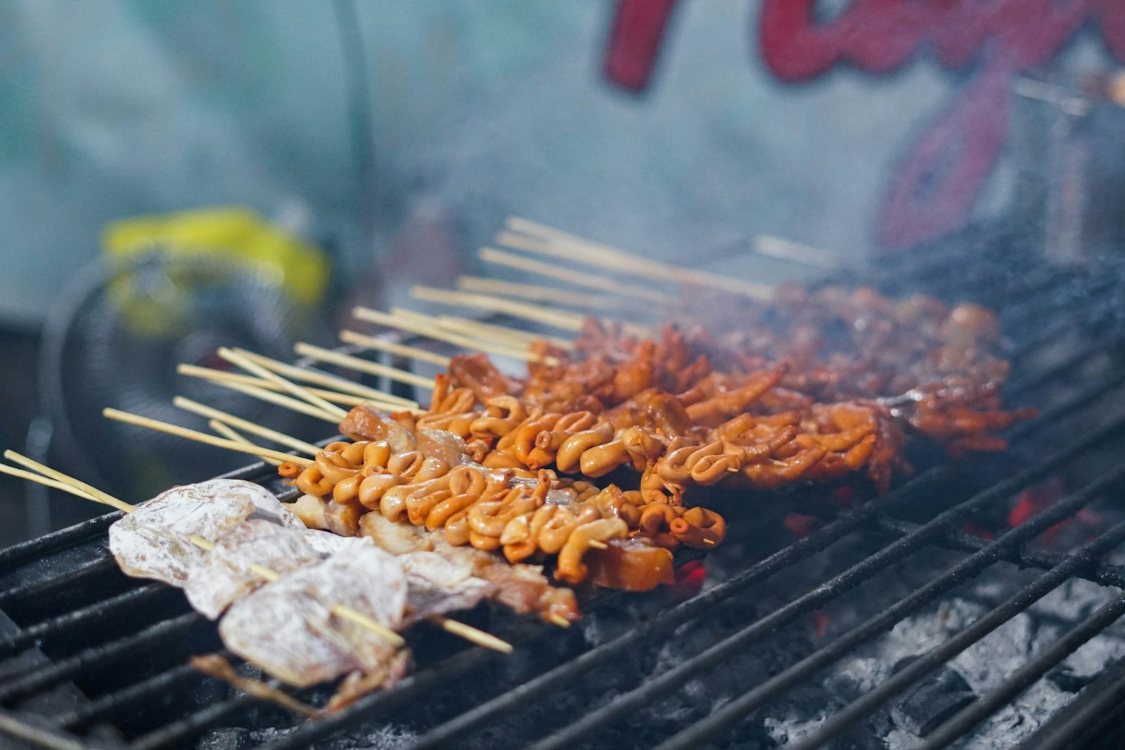 Filipino pork BBQ skewers on a grill