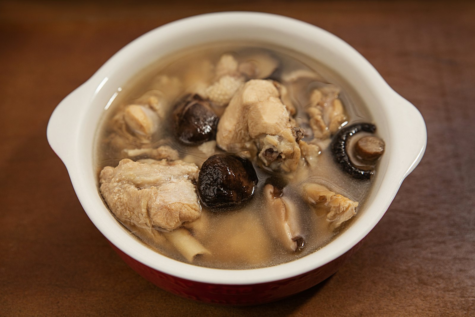 Filipino chicken ginger soup in a white pot