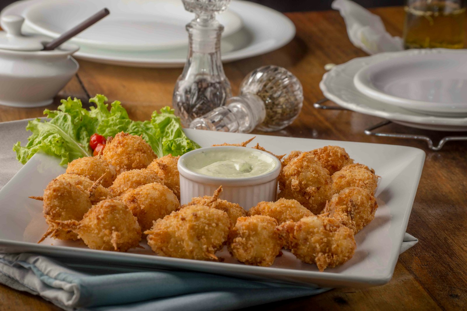 Golden coconut coated prawns with a creamy dip