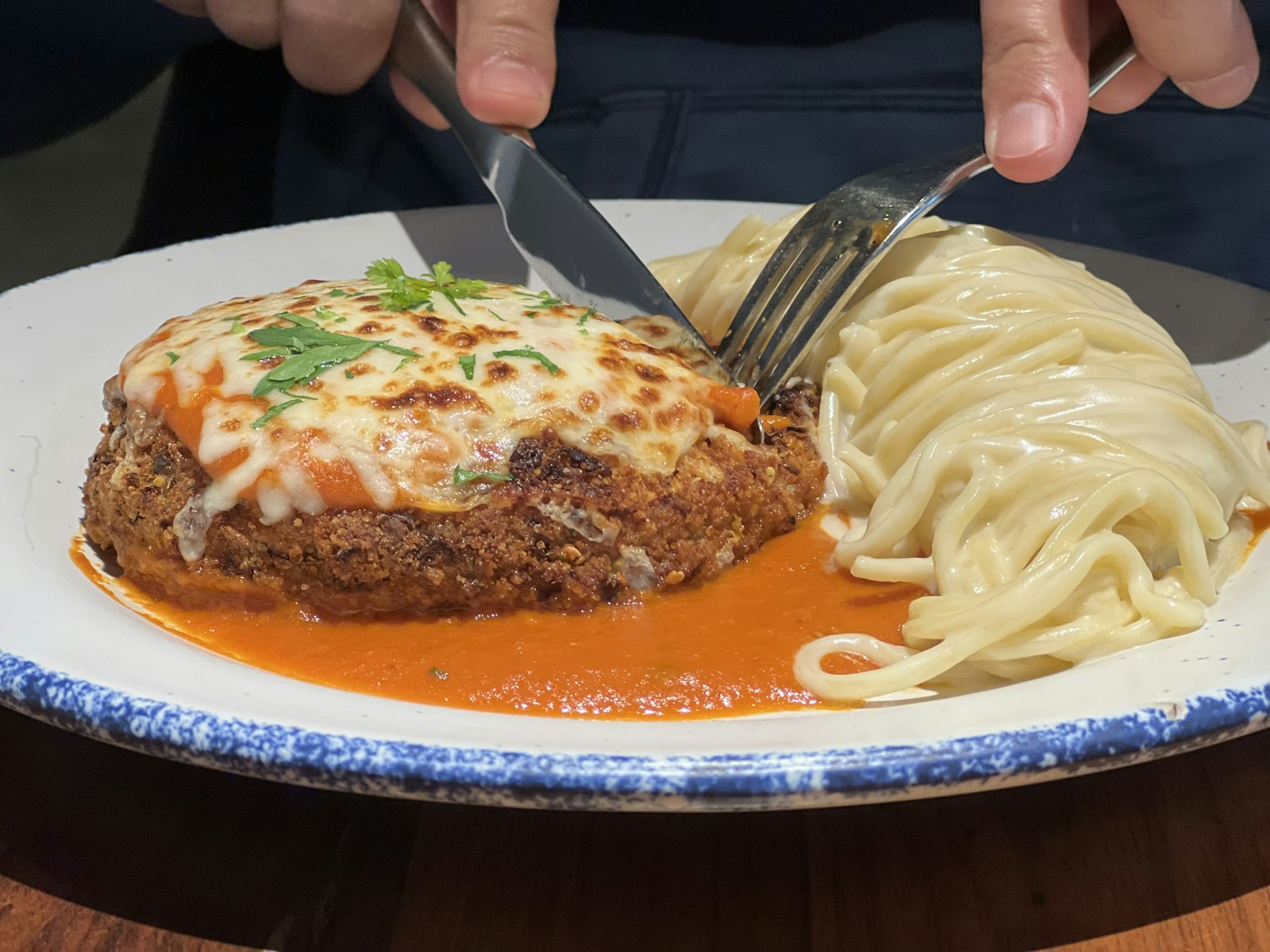 Italian American veal parmesan with spaghetti
