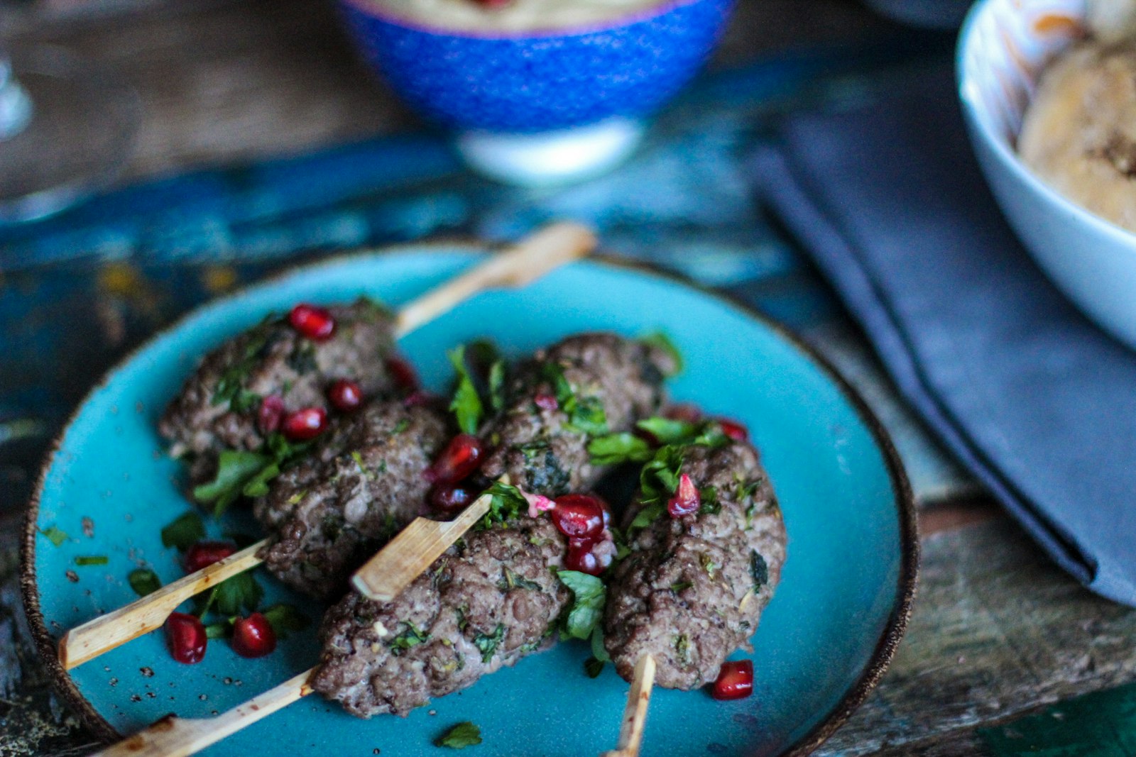 Grilled kefta kebabs with pomegranate seeds
