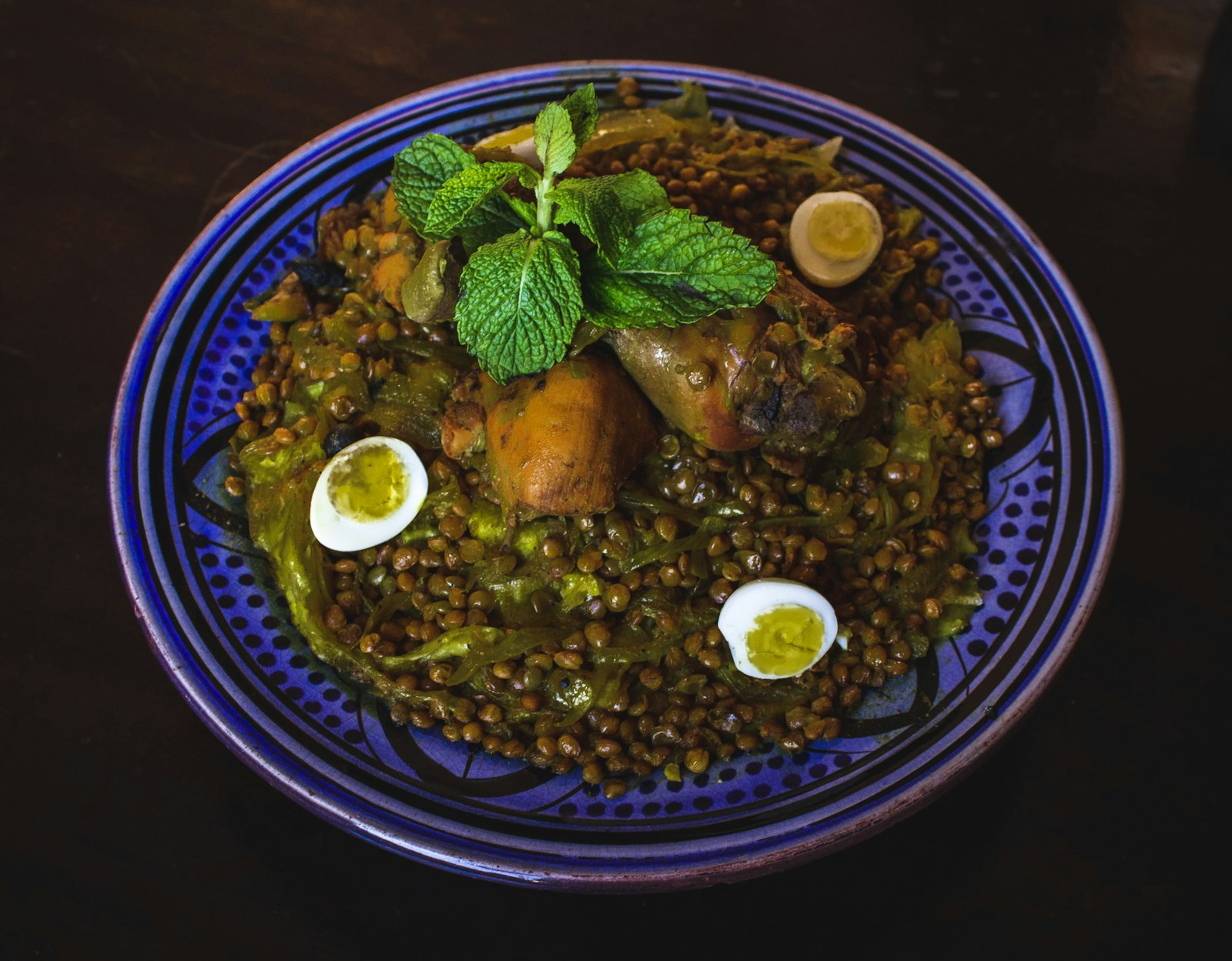 Moroccan spiced lentil stew with eggs and herbs