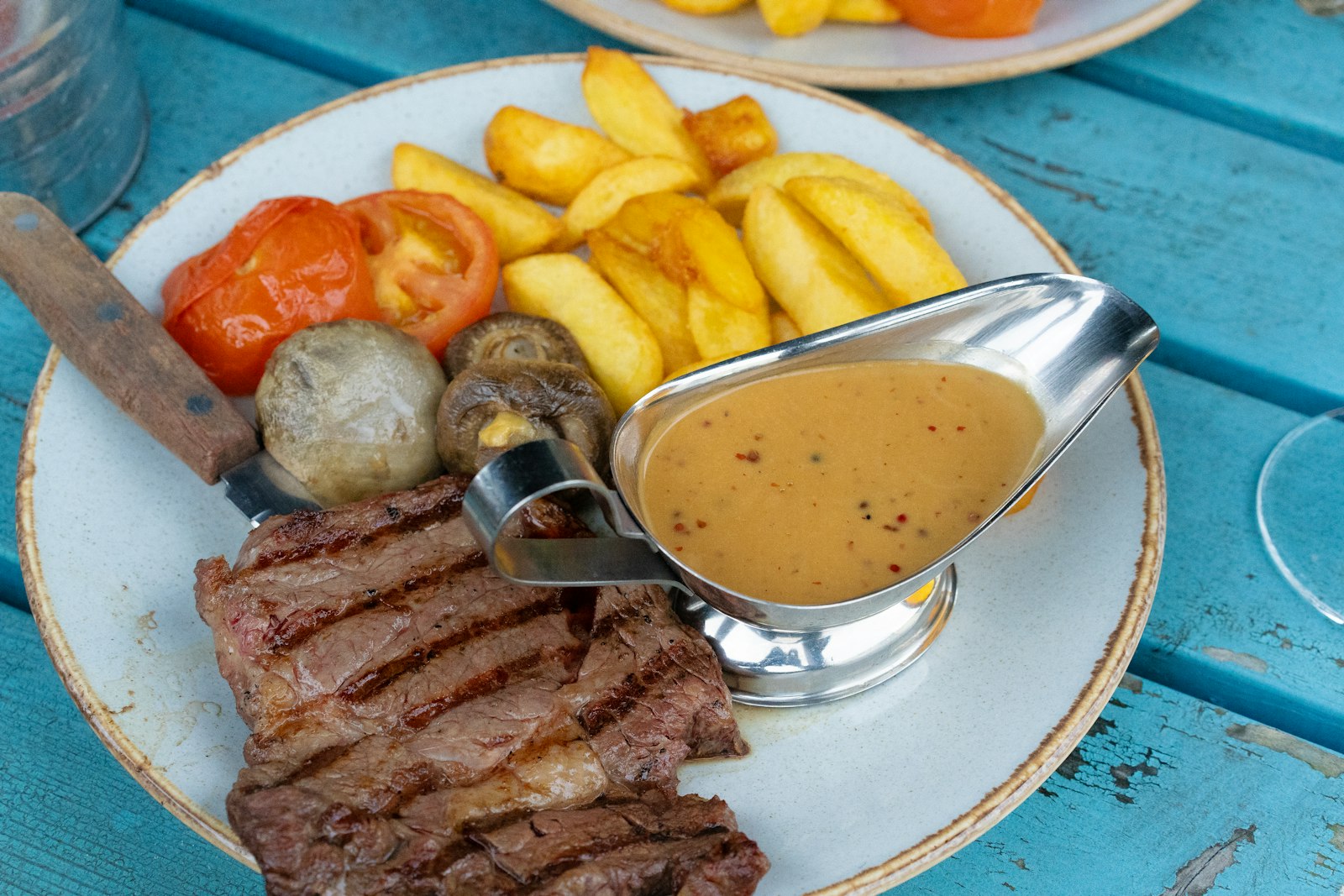 Steak with sauce and fries, a retro dinner favorite