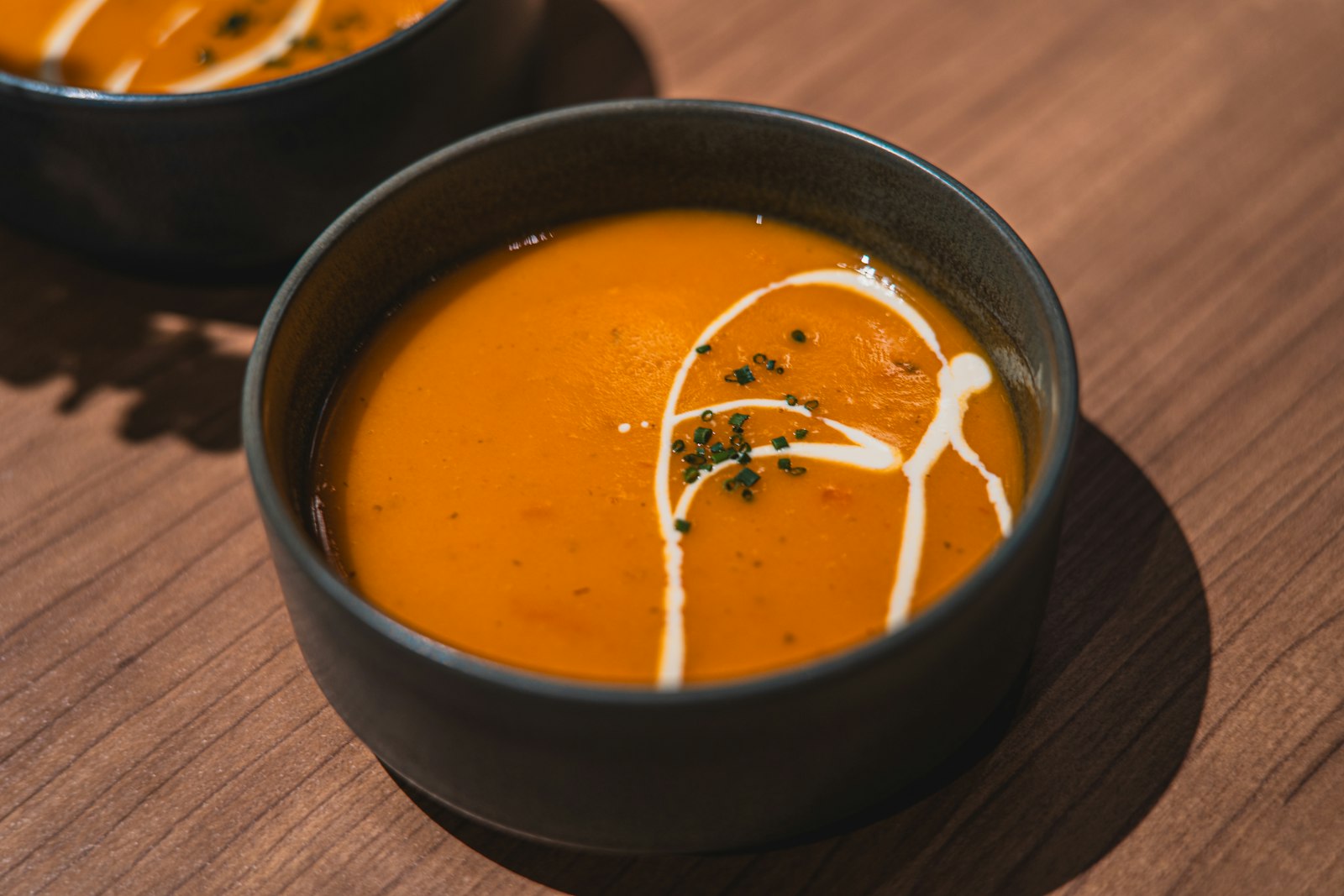 Fall soups to warm you up: carrot ginger soup with a cream swirl