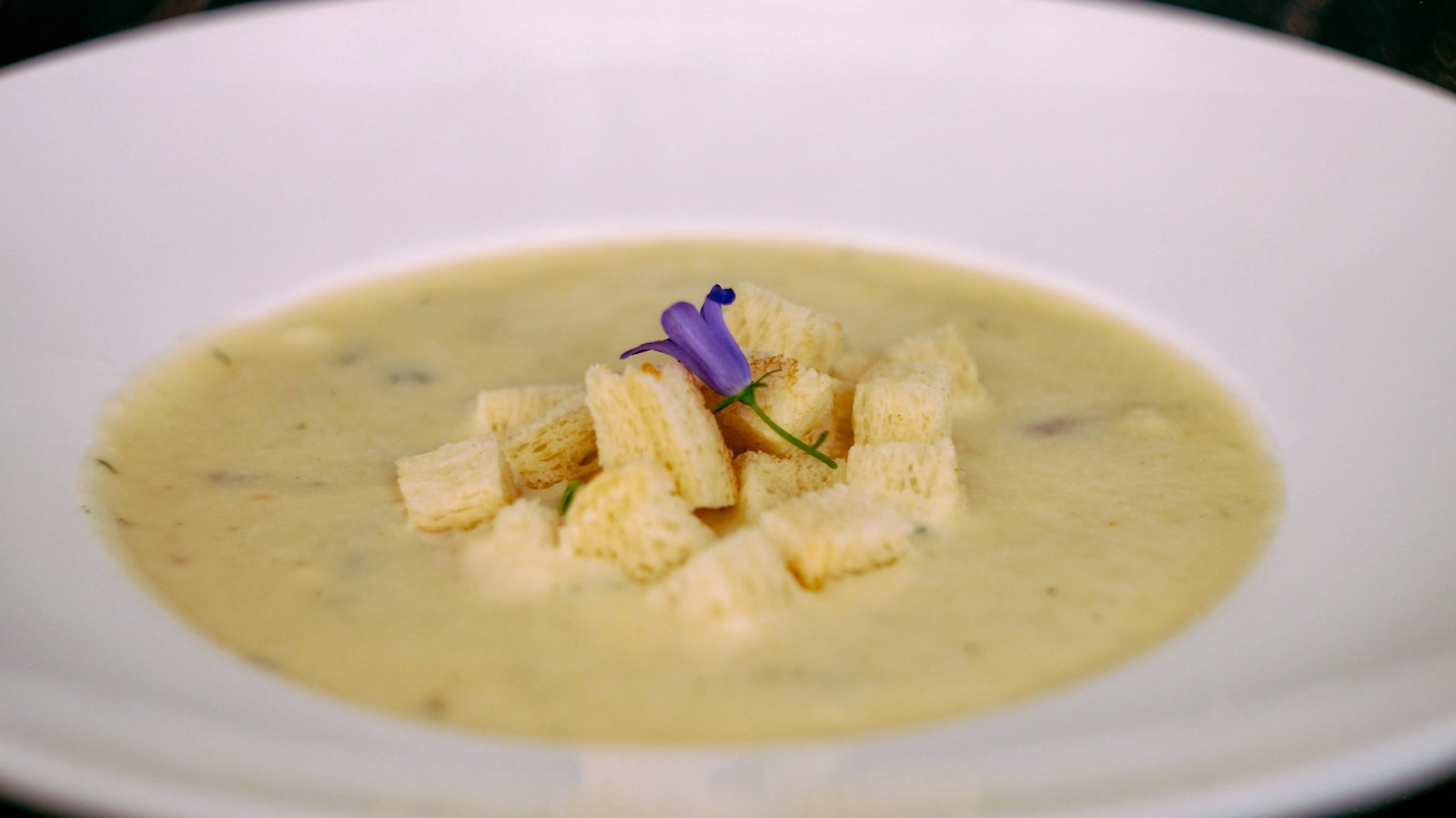 Creamy roasted cauliflower soup with croutons