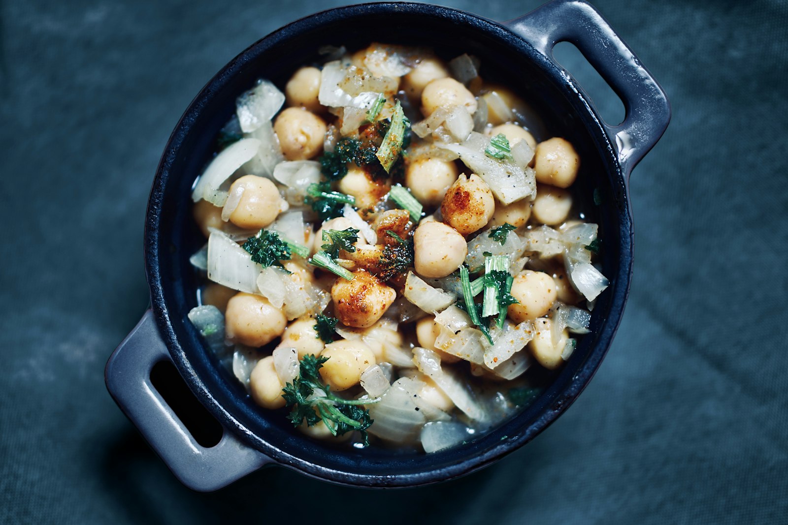 Chickpea and greens soup in a rustic bowl