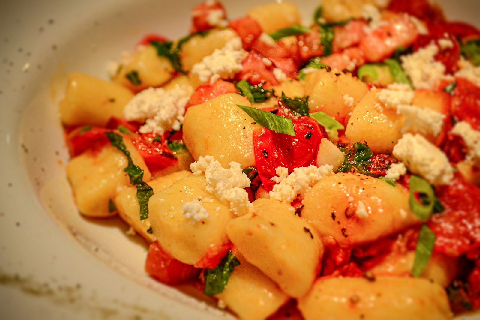 Crispy roasted gnocchi with cherry tomatoes and feta, a cozy sheet pan dinner