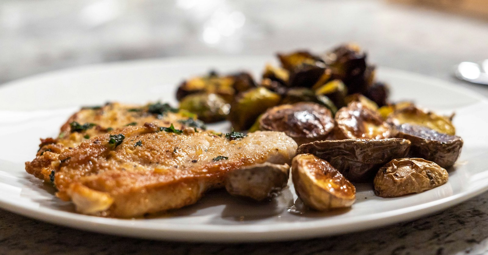Golden lemon herb chicken with roasted baby potatoes