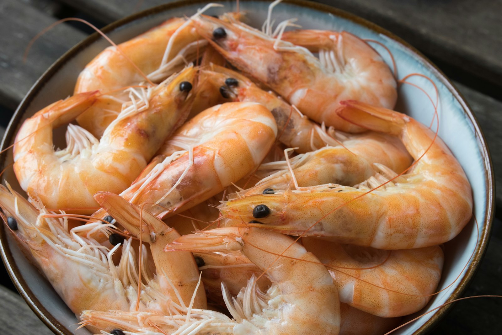 Juicy roasted shrimp piled on a plate