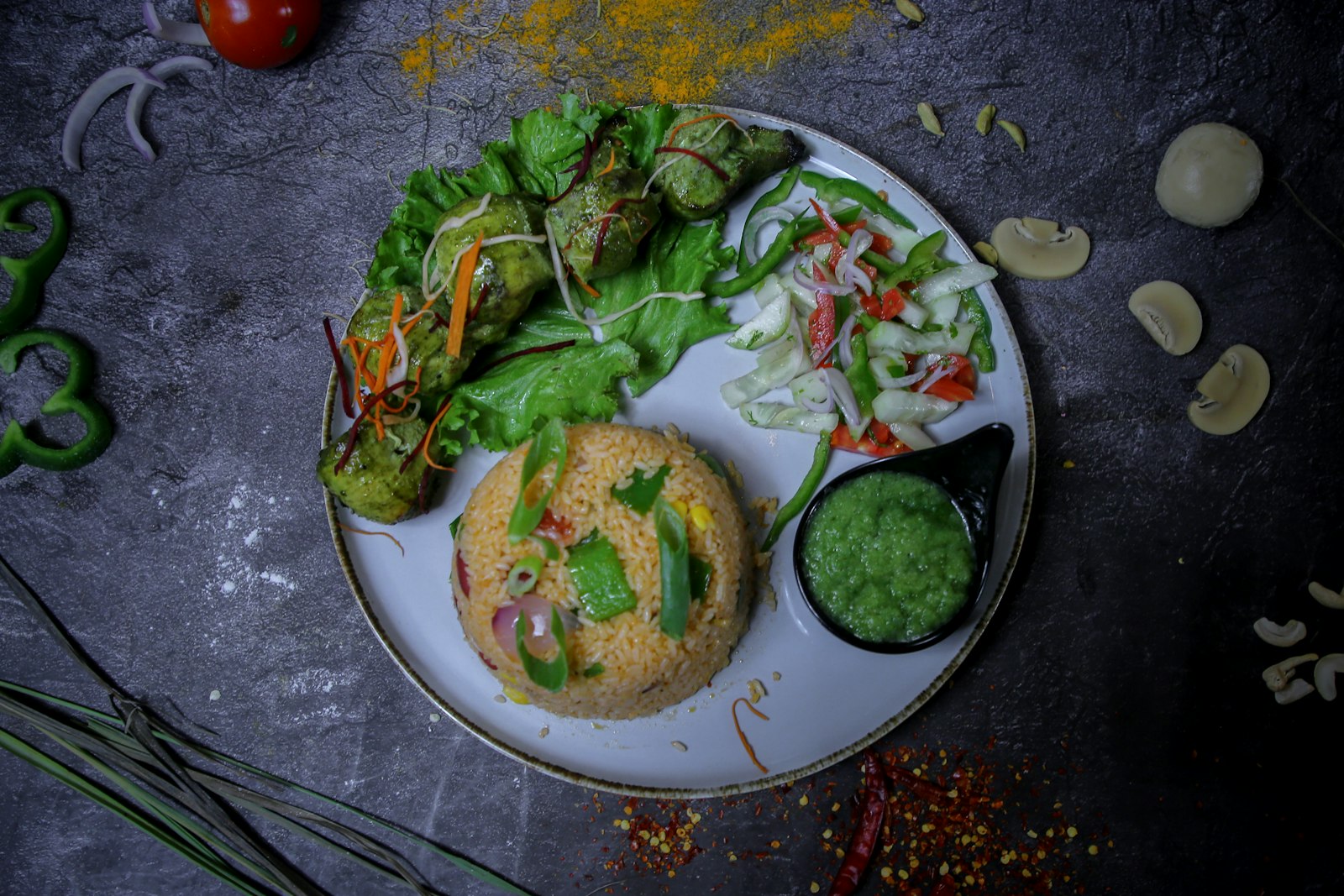 Bowls of green curry with fresh herbs
