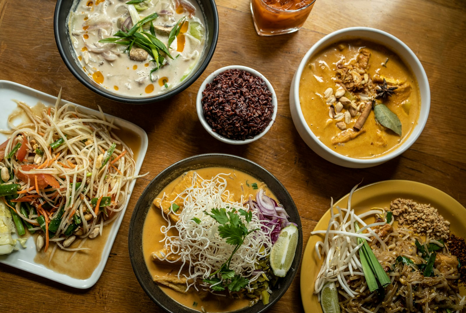 Green papaya salad with a spread of dishes