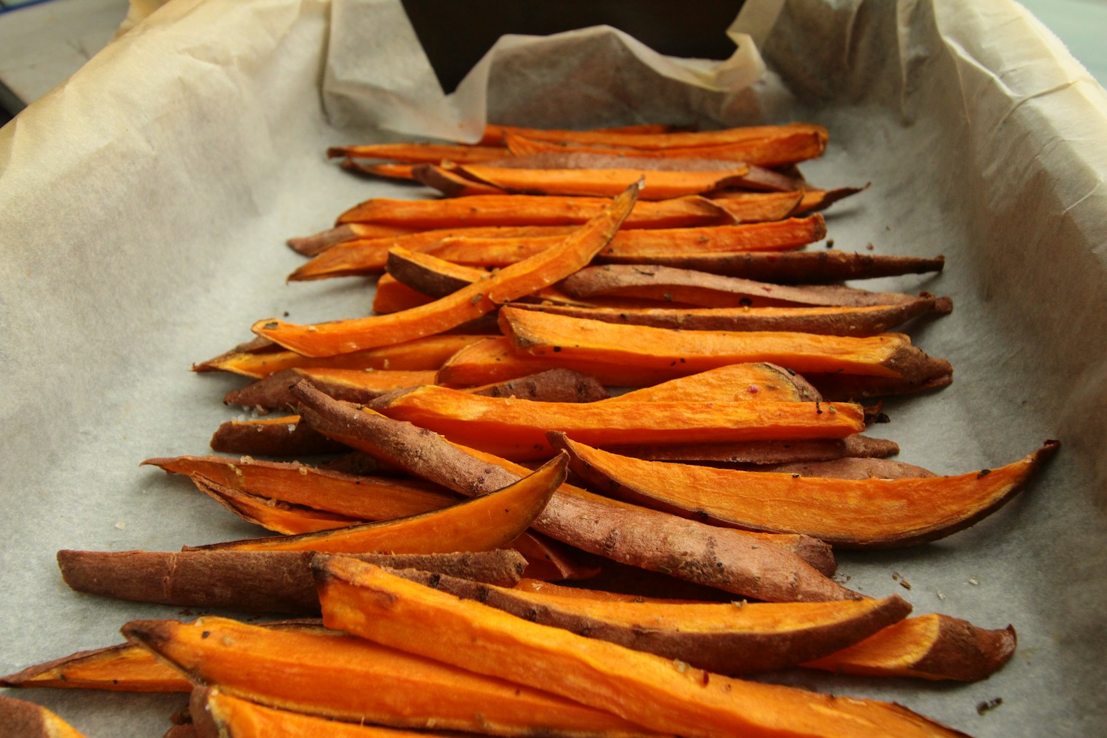 Roasted sweet potato wedges on a tray