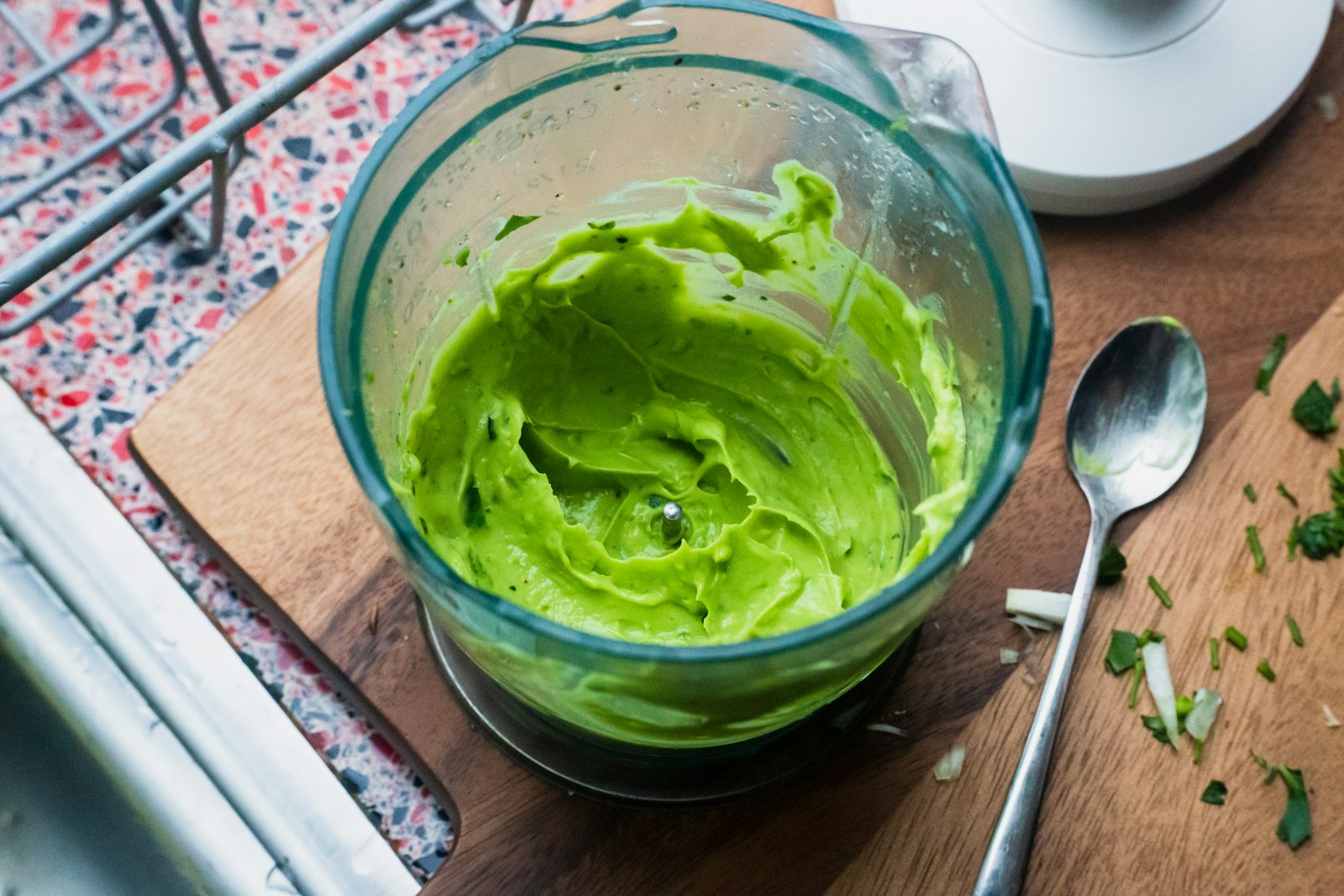 Creamy avocado lime dressing in a glass