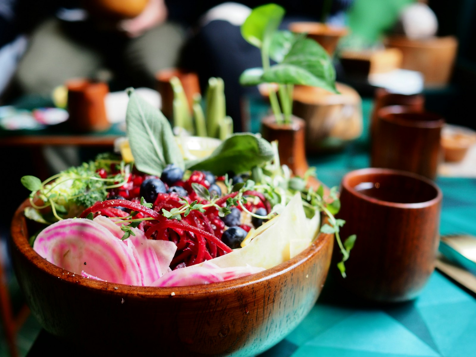 Rainbow buddha bowls with beets, berries and fresh herbs