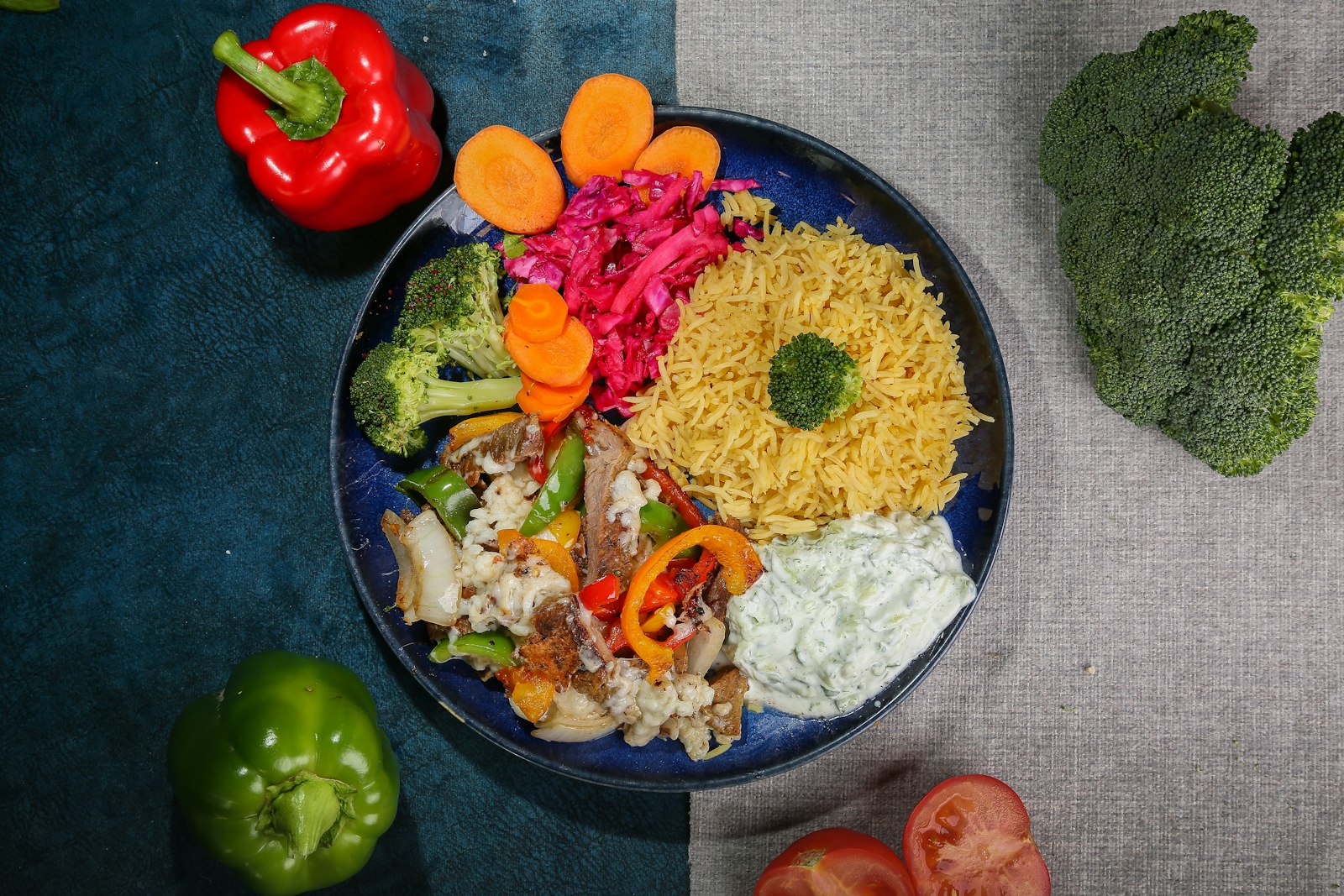 Chicken shawarma with yellow rice, vegetables and garlic yogurt sauce