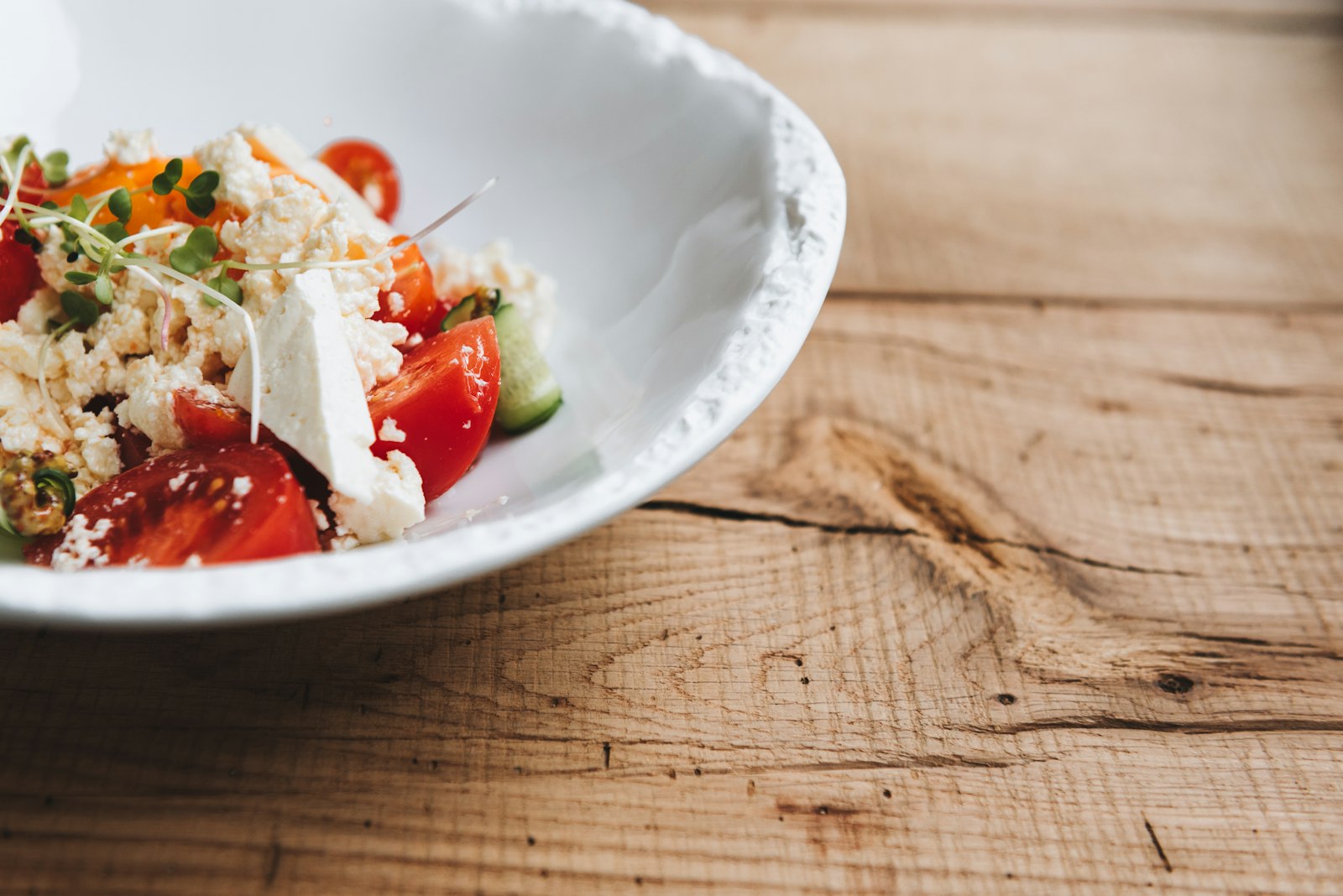 Greek style salad in a white bowl