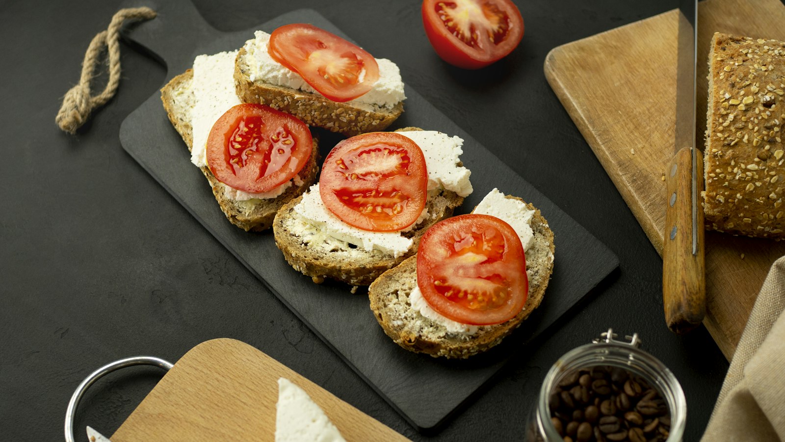 Cottage cheese toast topped with tomato slices
