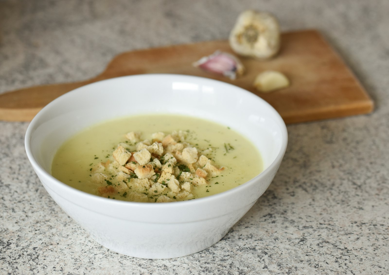 Creamy soup topped with toasted nuts