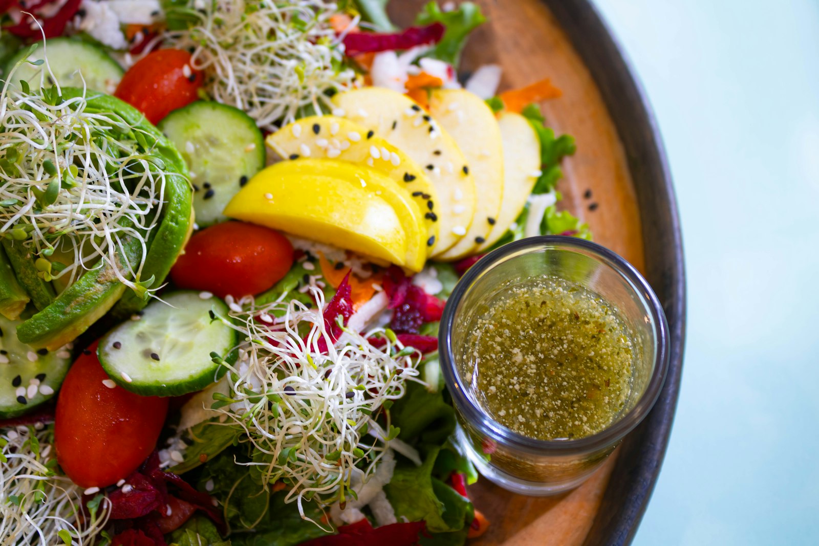 Fresh salad with apple cider vinaigrette jar