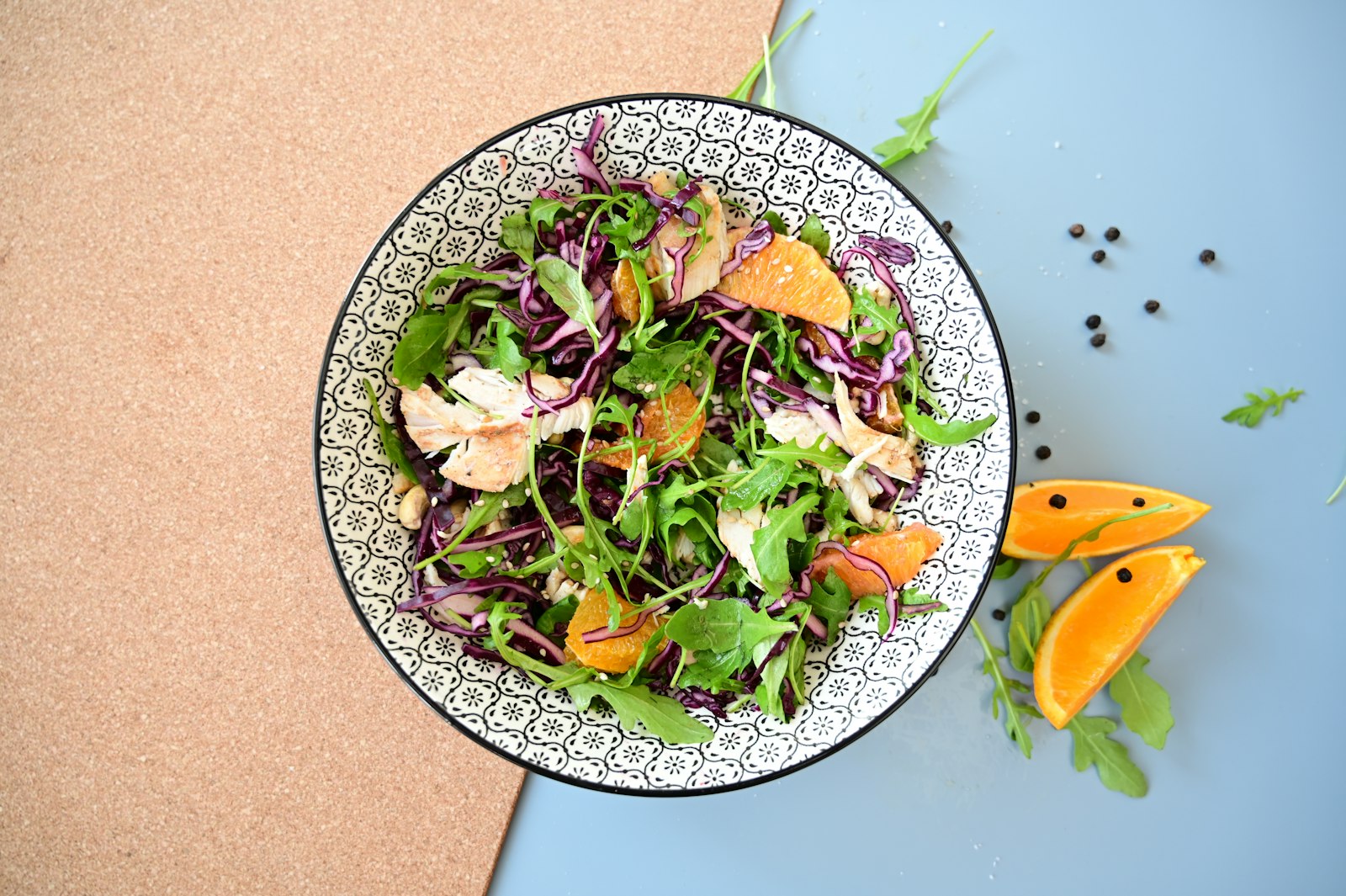 Orange and greens salad in a bowl
