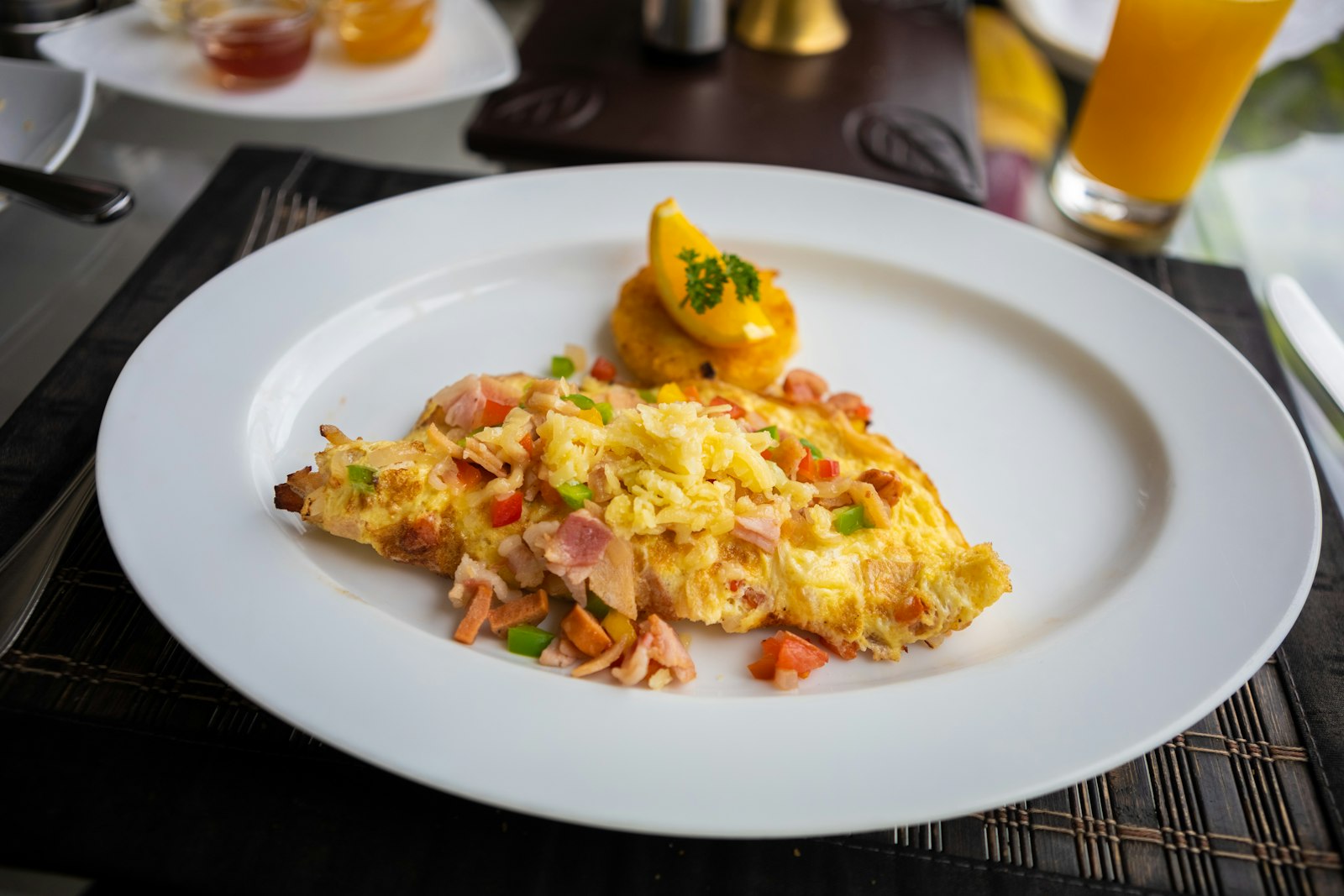 Fluffy scrambled egg omelet on a white plate