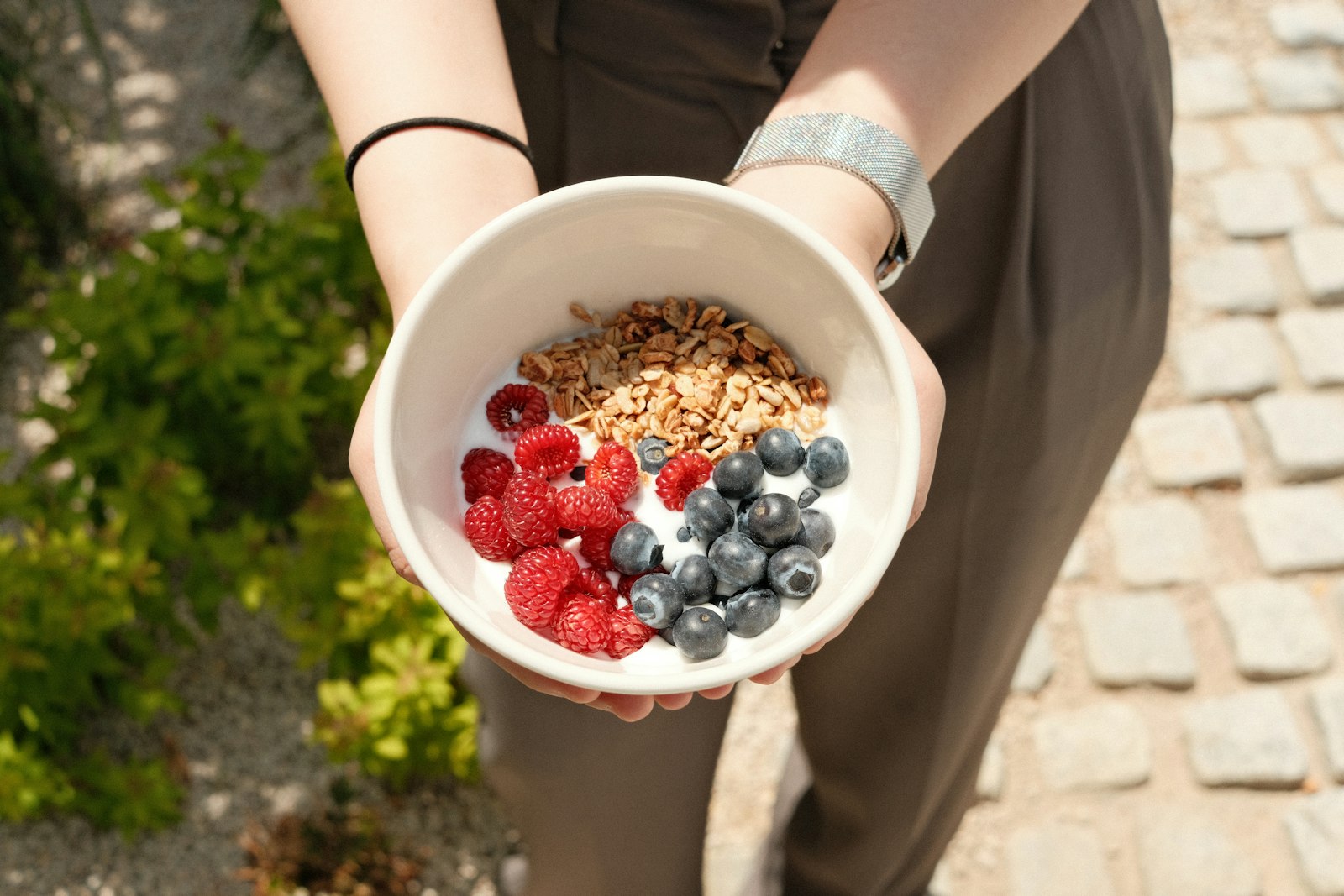 Yogurt bowl with raspberries, blueberries and granola