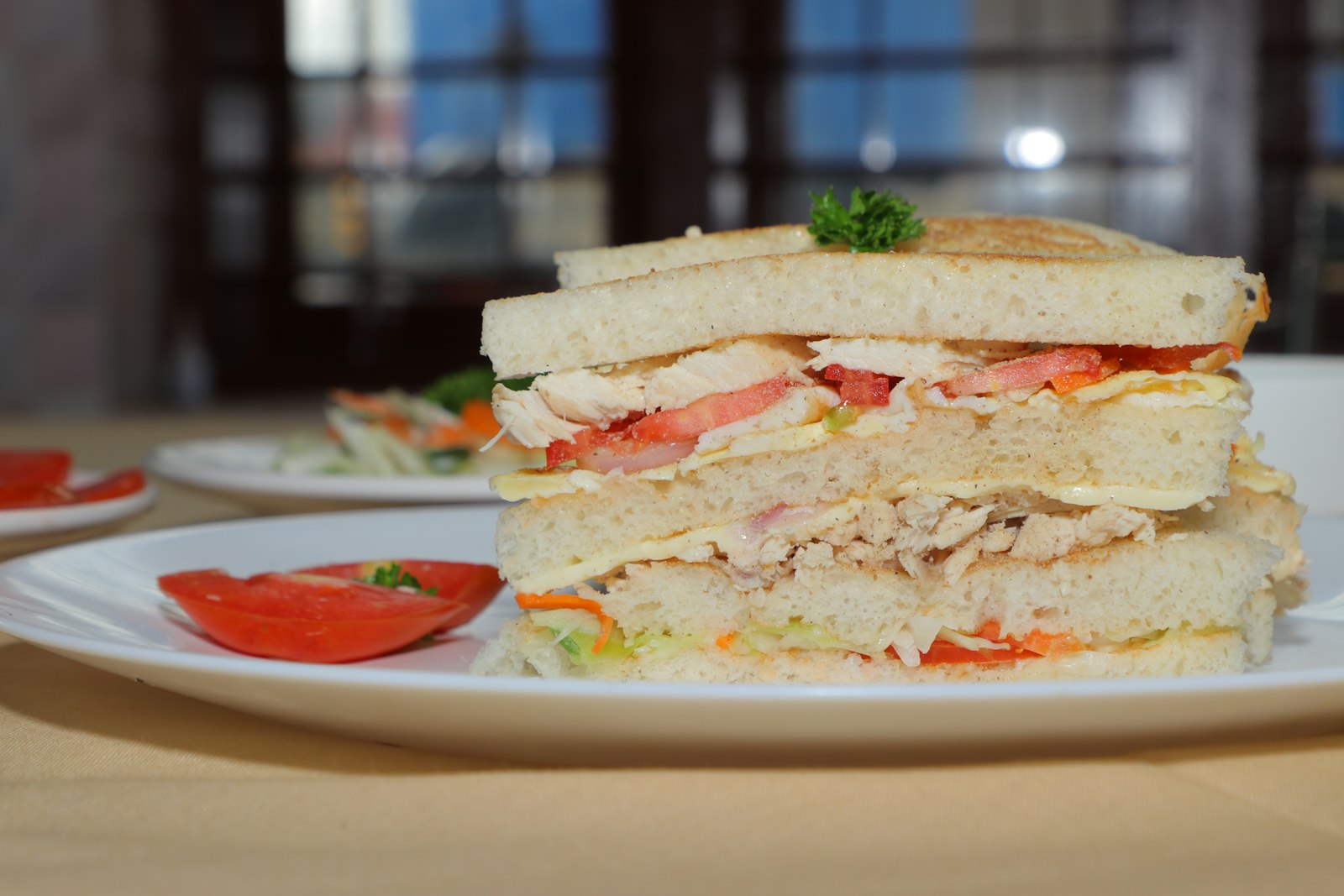 Tall club sandwich on a plate