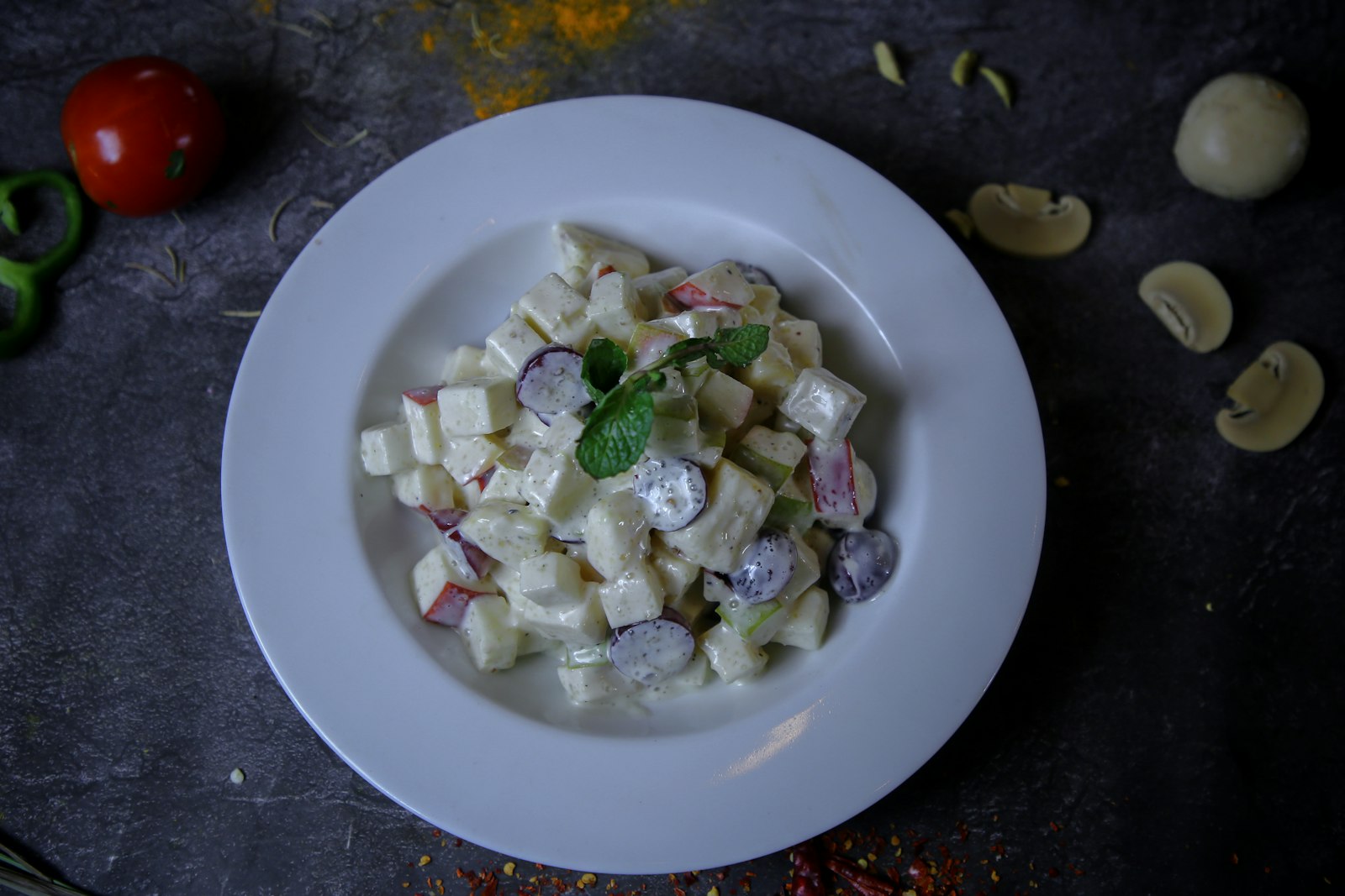 Deli style Olivier salad in a white bowl