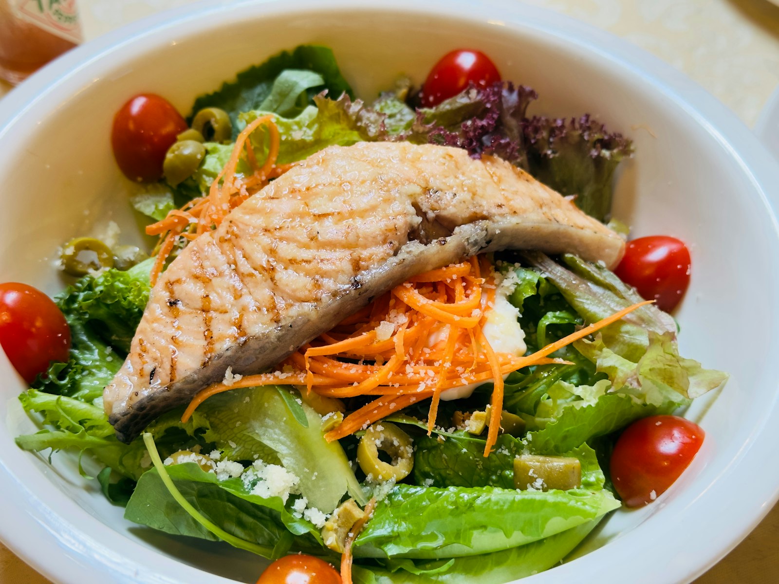 Salmon over fresh greens