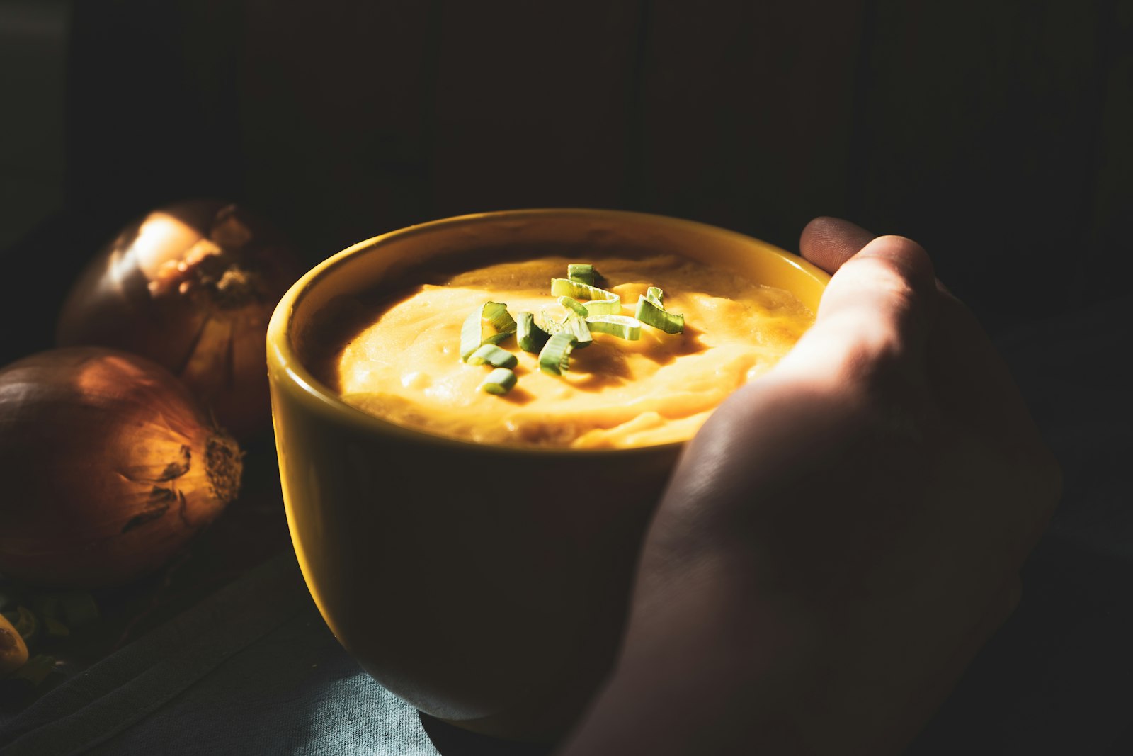 Beer cheese dip being scooped