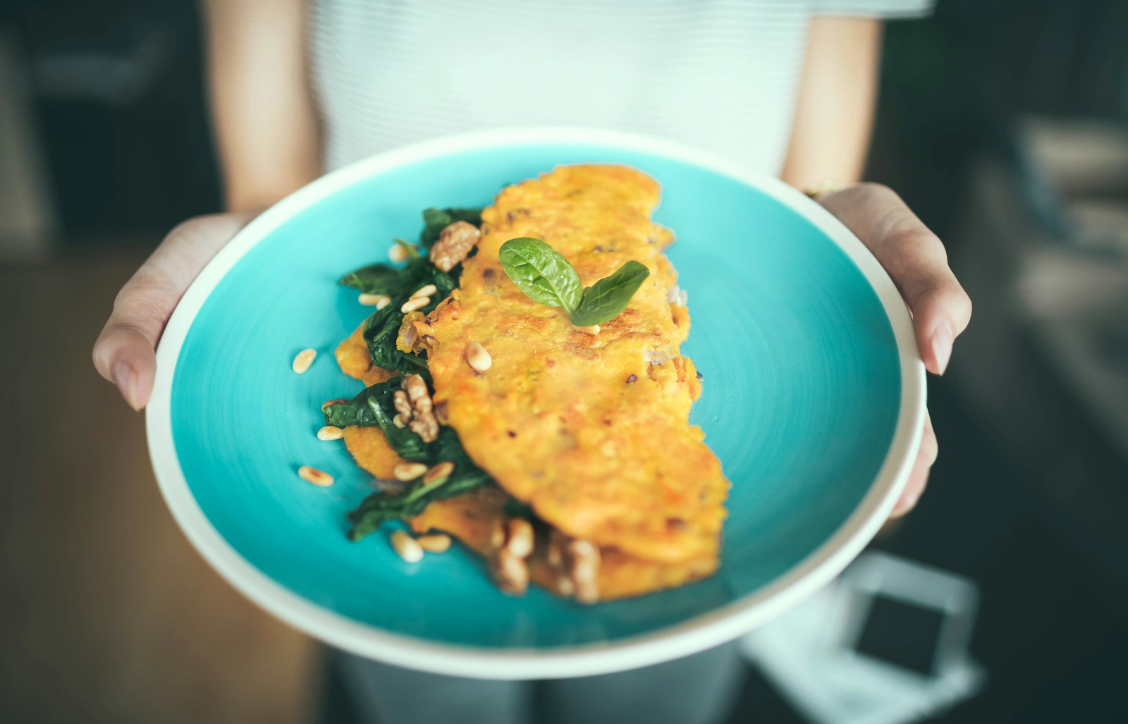 Spinach and feta omelet on a teal plate
